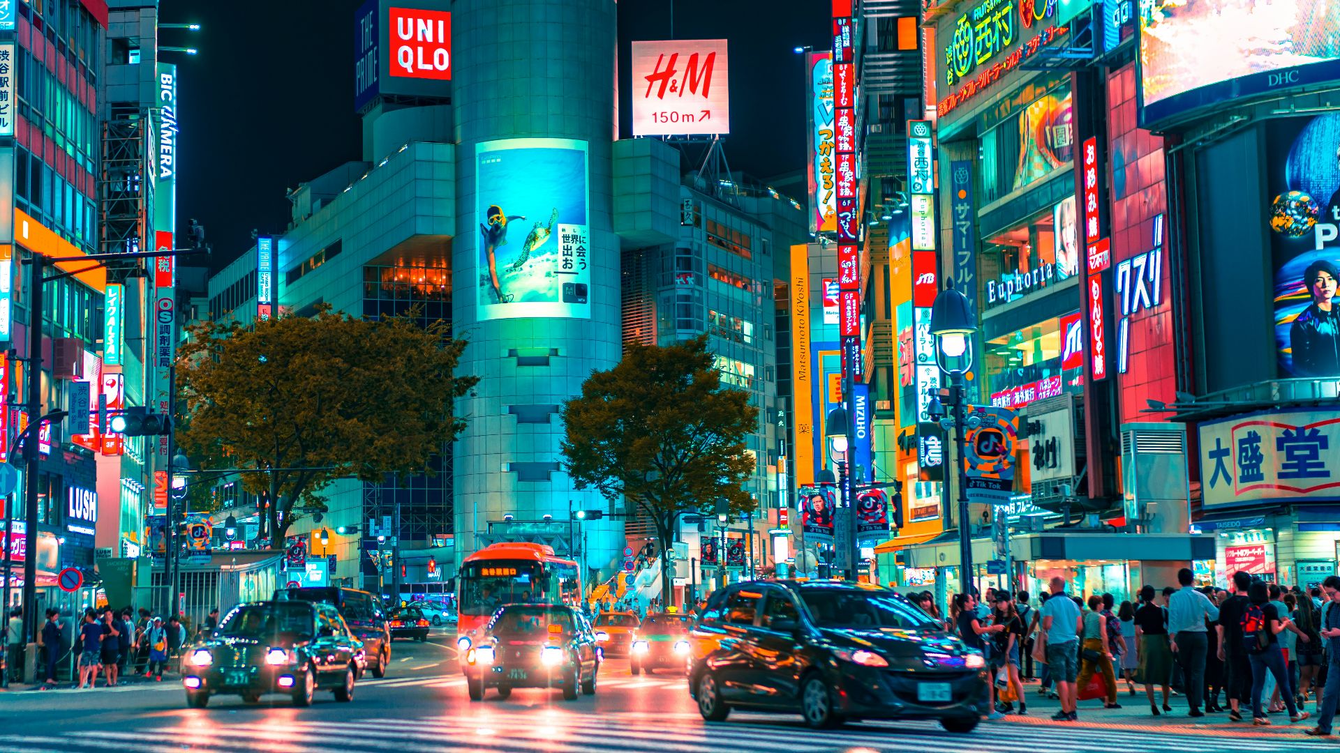 people gathered outside buildings and vehicles