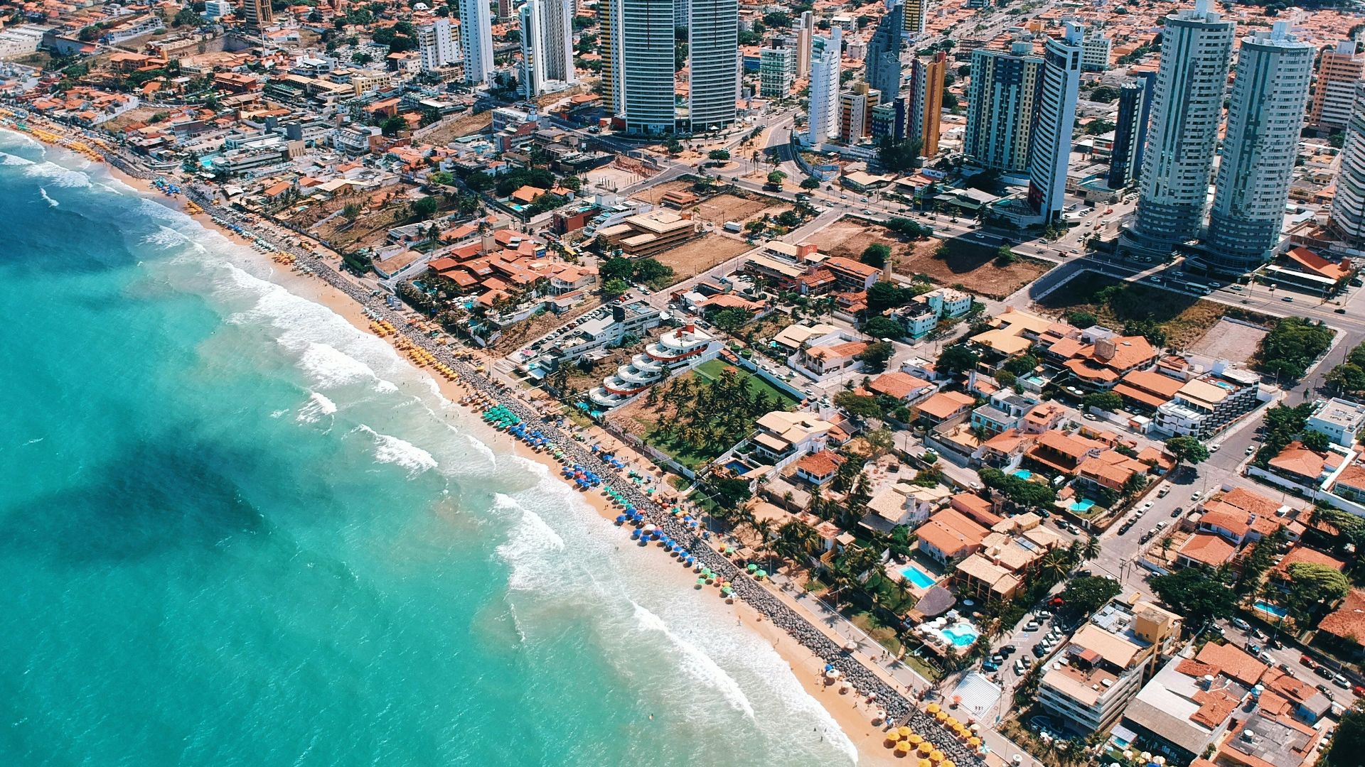 aerial photography of city building near the seashore during daytime