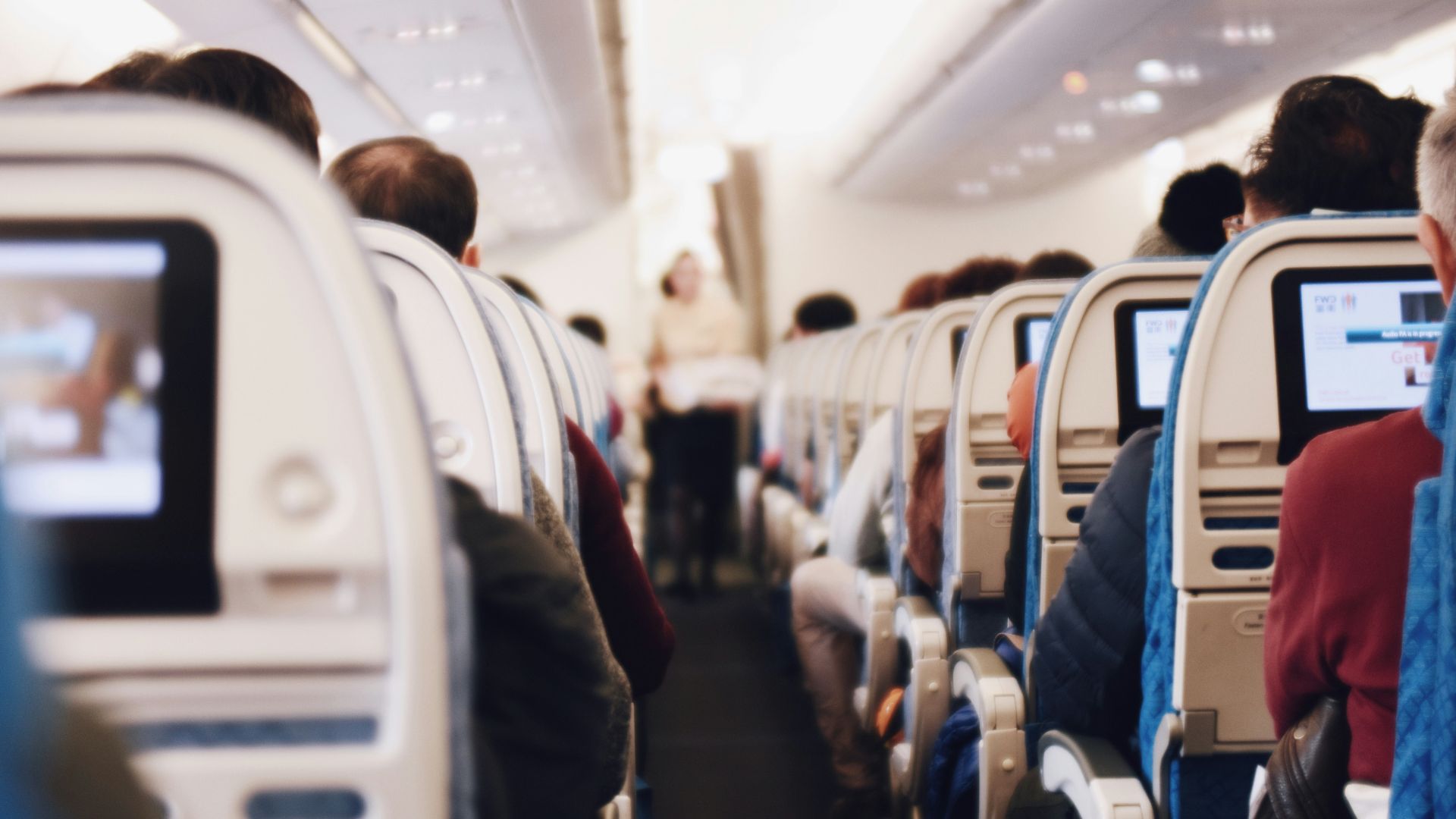 shallow focus photography of people inside of passenger plane