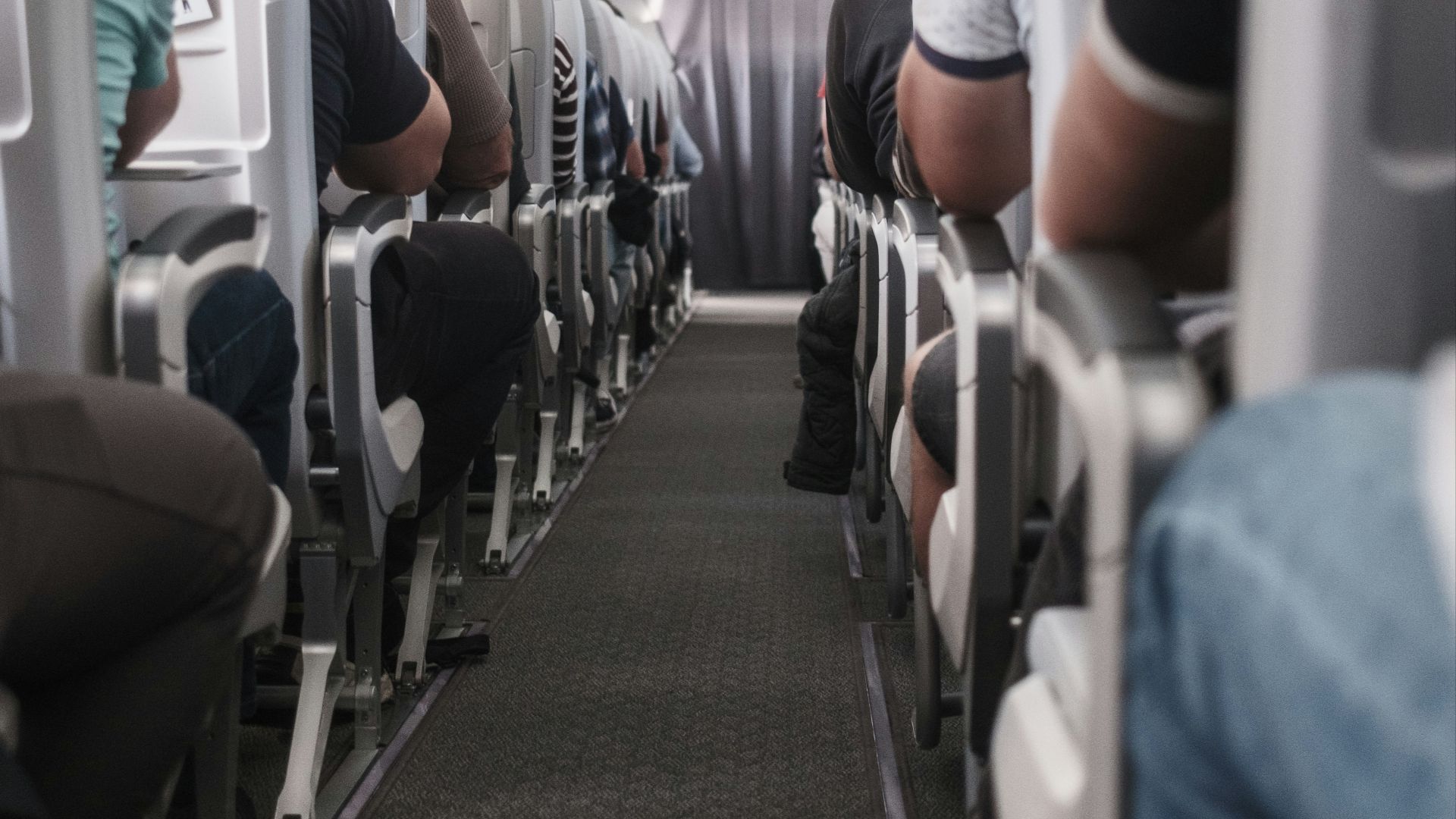 View down the aisle of a commercial airplane