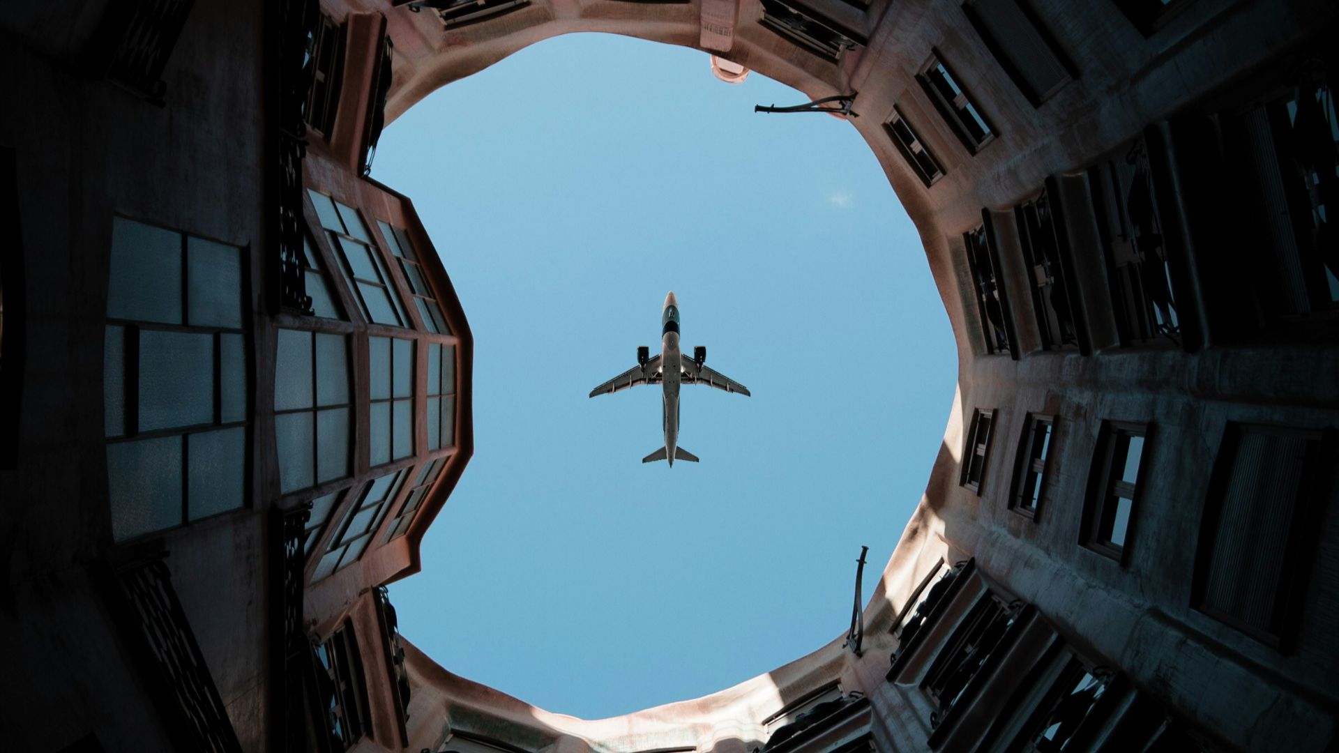 a plane flying over a city