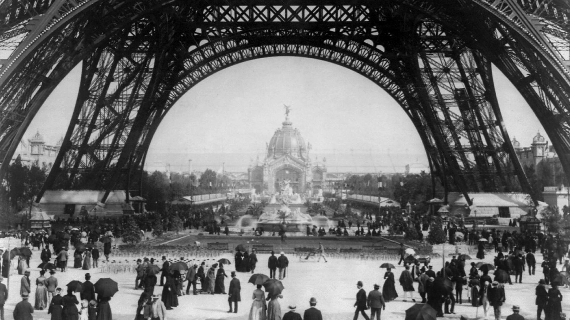 File:Flickr - …trialsanderrors - Paris Exposition, view from ground level of the Eiffel tower with Parisians promenading, 1889.jpg