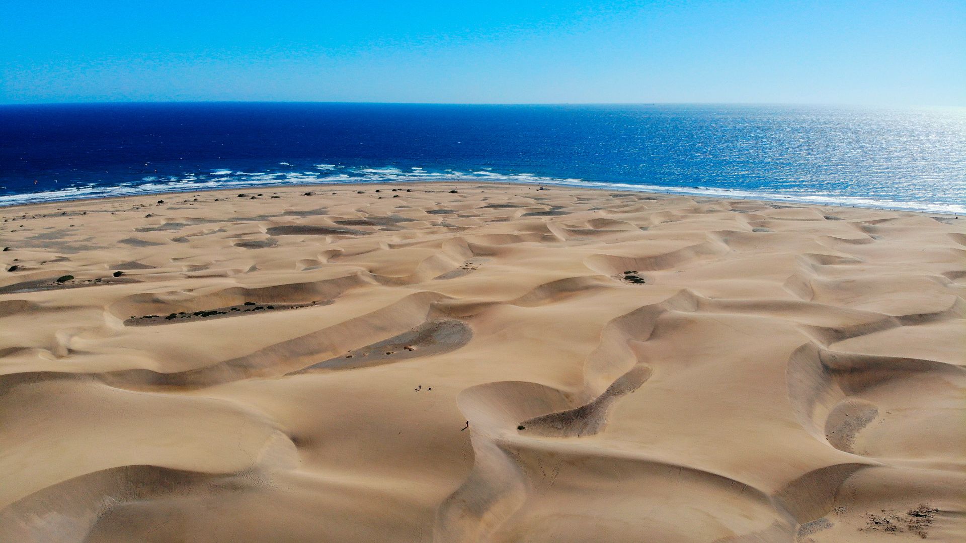 white ice on blue sea under blue sky during daytime