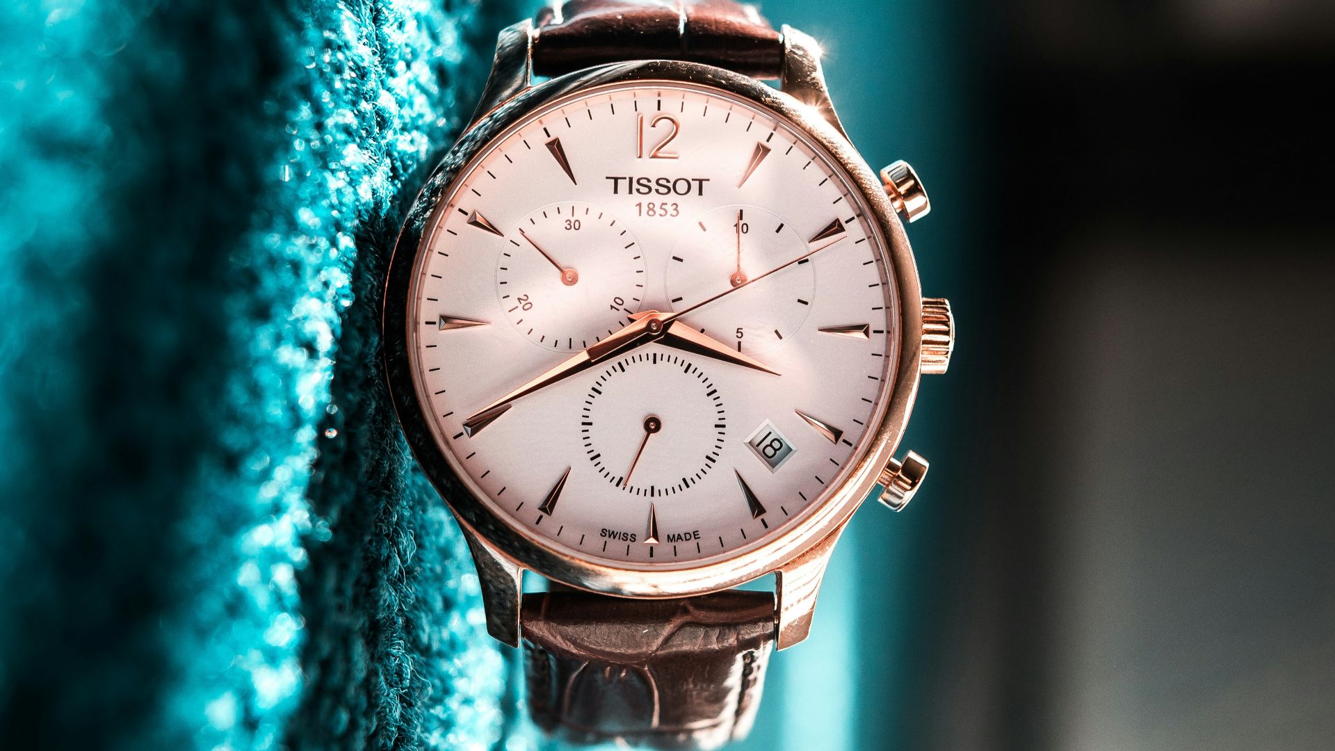 round silver-colored Tissot chronograph watch