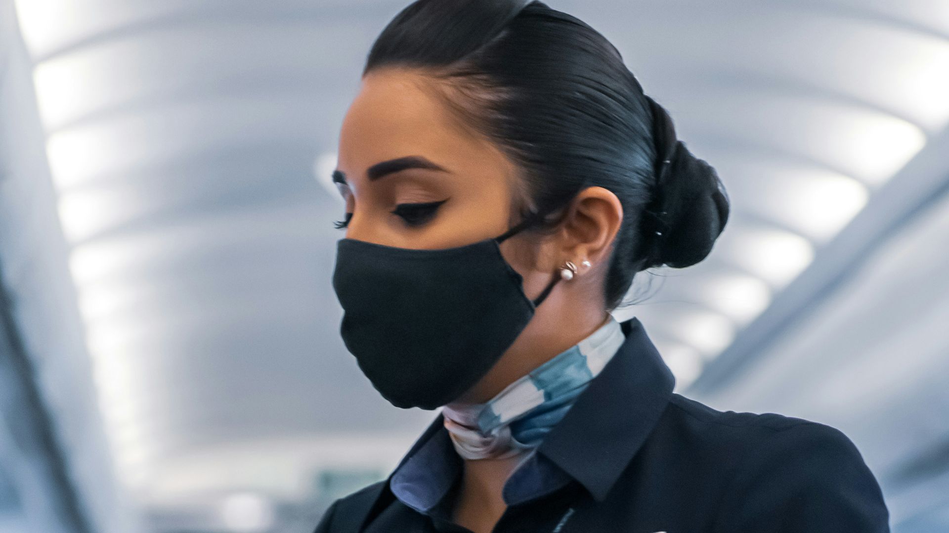 man in black suit jacket wearing mask