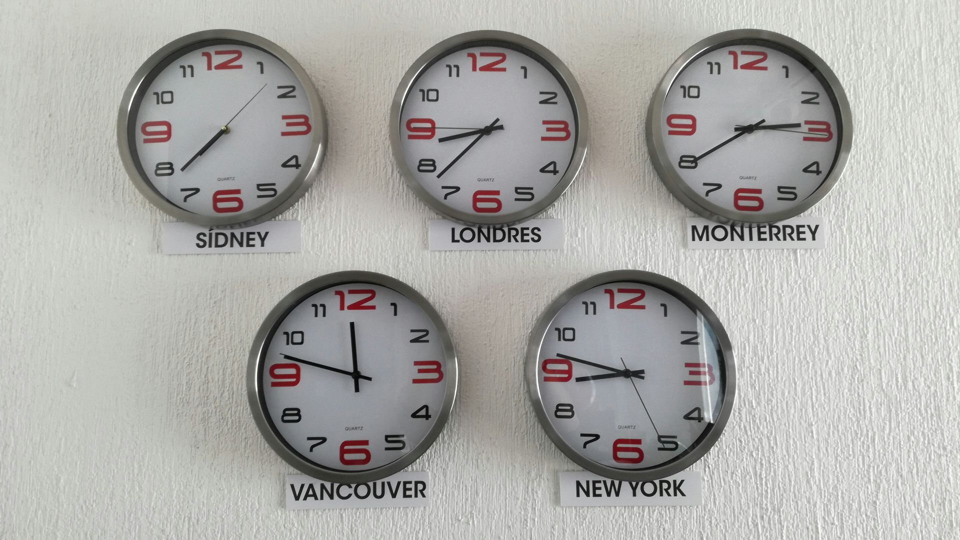 five assorted country wall clocks