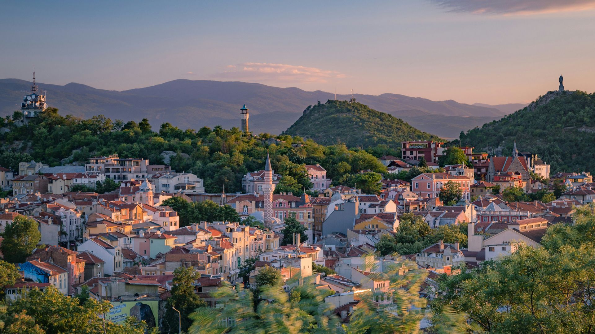 a small town surrounded by trees and mountains