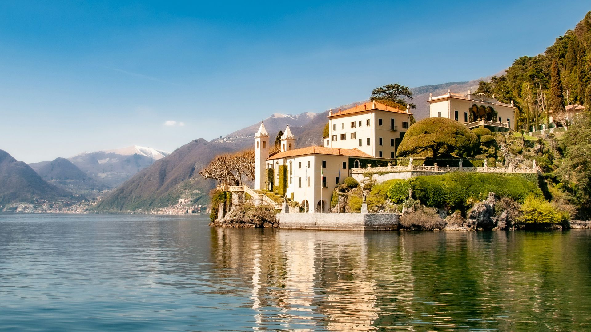 white concrete building near body of water during daytime