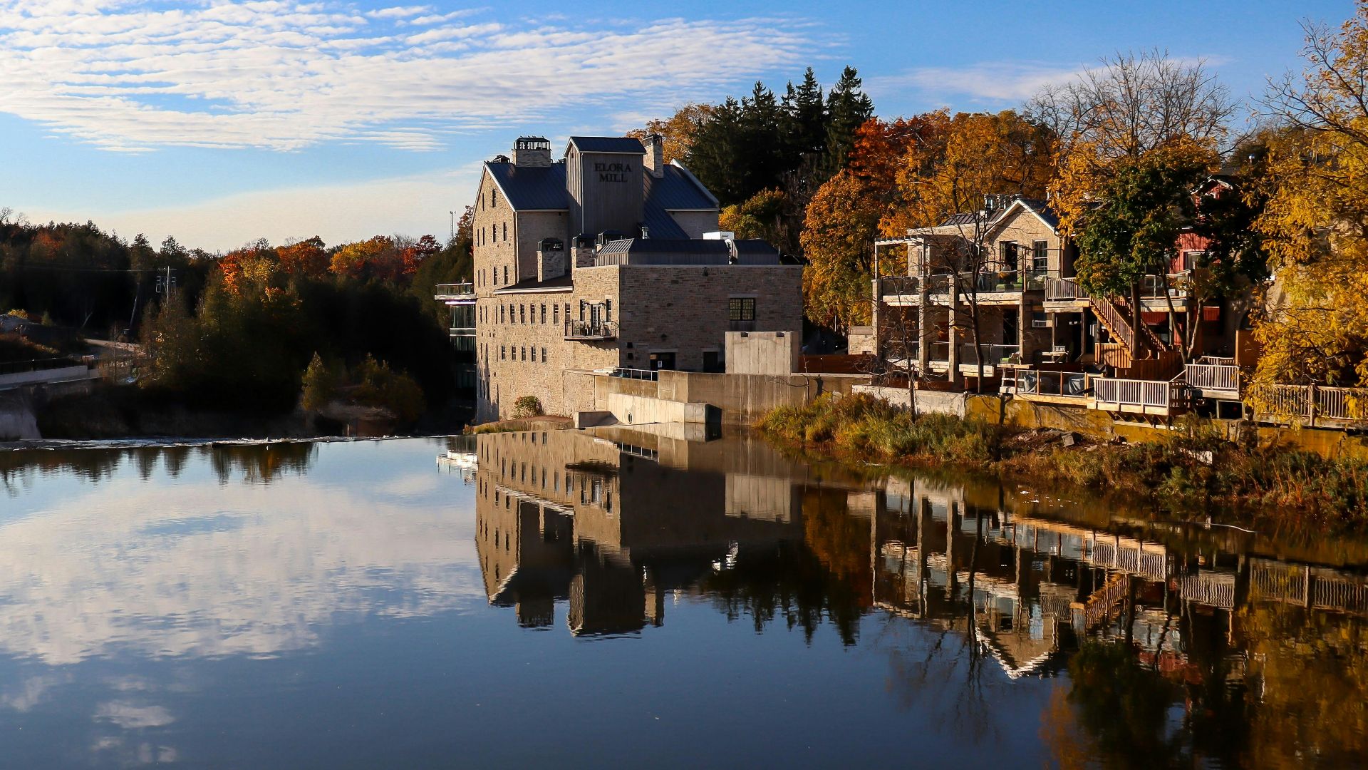 white concrete building near body of water during daytime