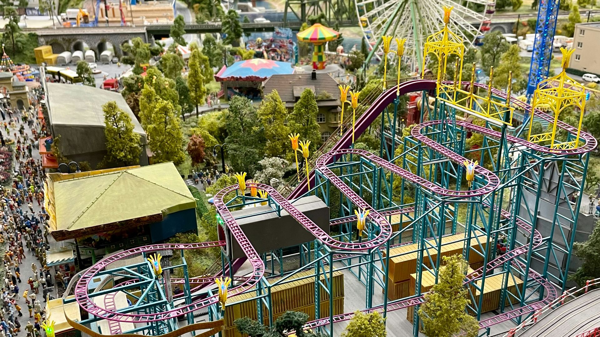a model of a carnival with a roller coaster