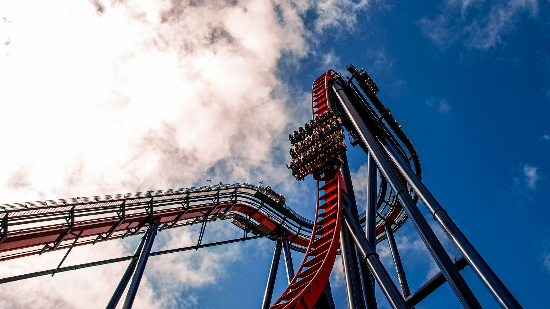 a roller coaster with a sky background