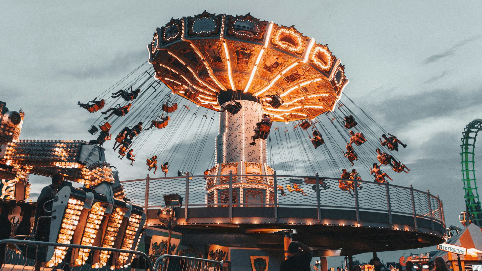 people riding amusement park ride