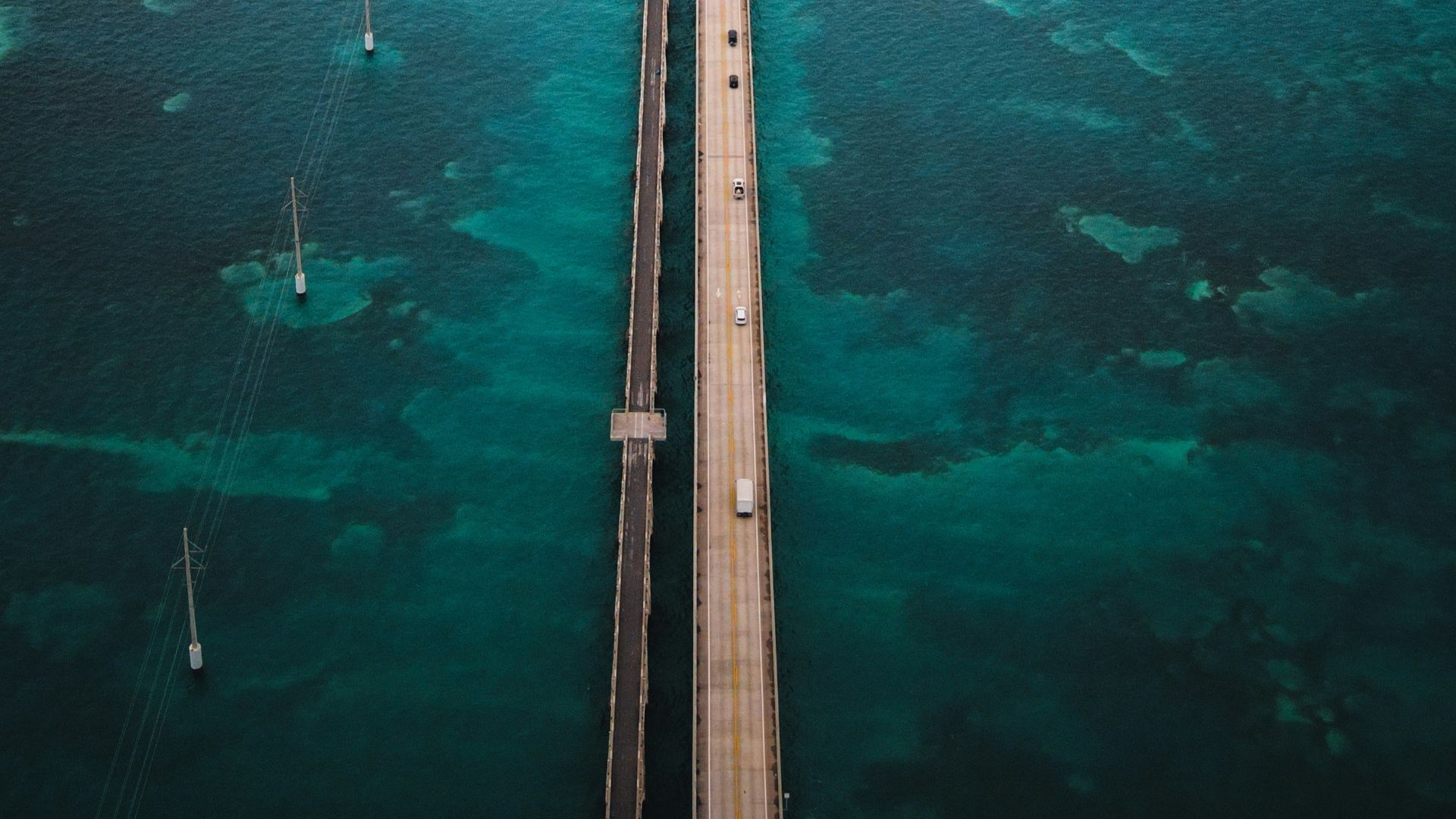 gray wooden dock on body of water during daytime