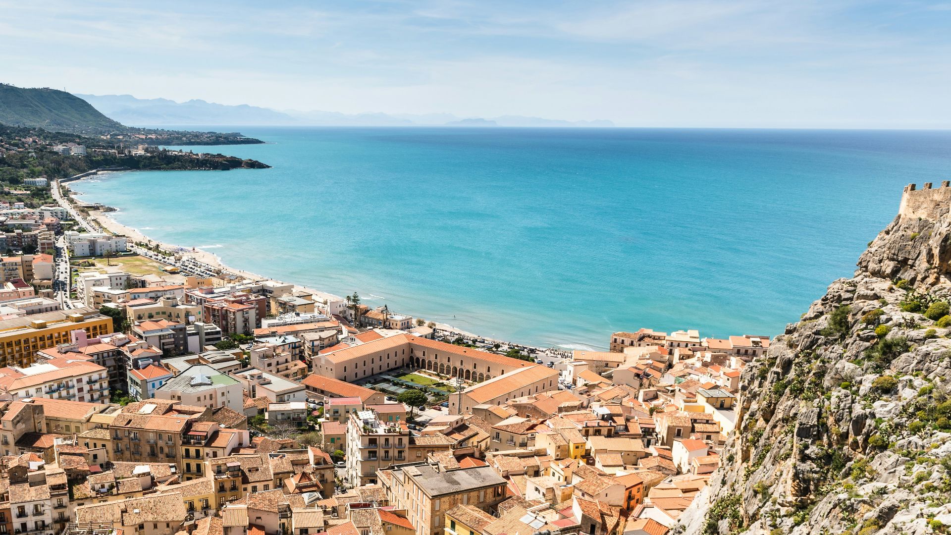 aerial photography of brown town near ocean
