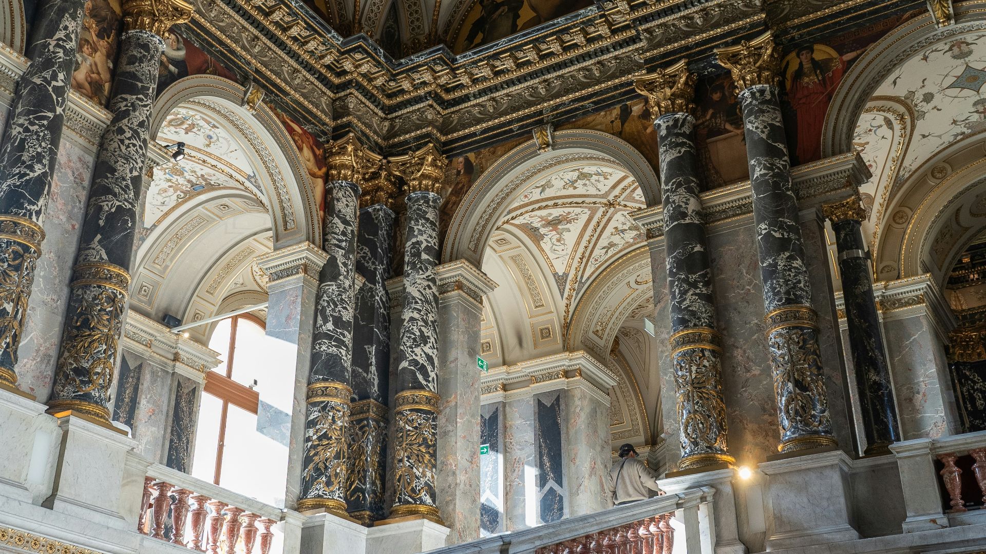Opulent staircase inside an ornate building.