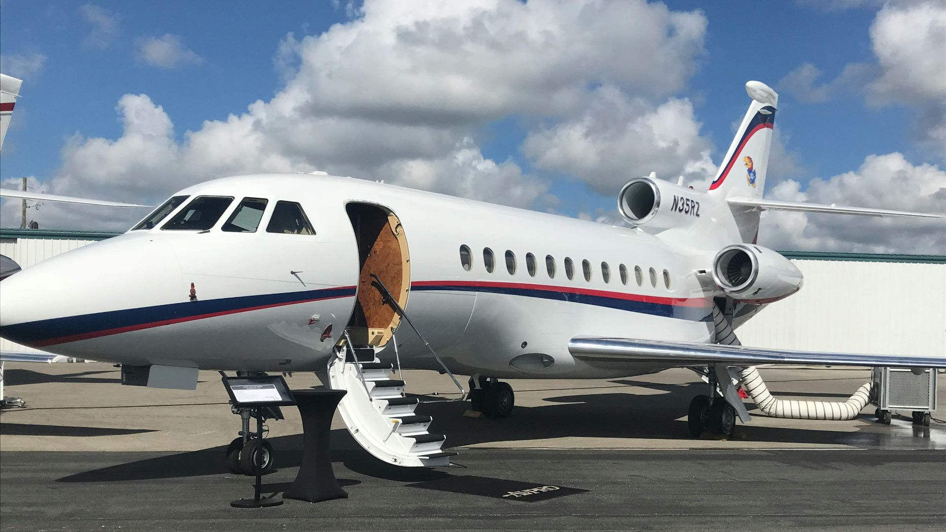 white airliner on gray pavement