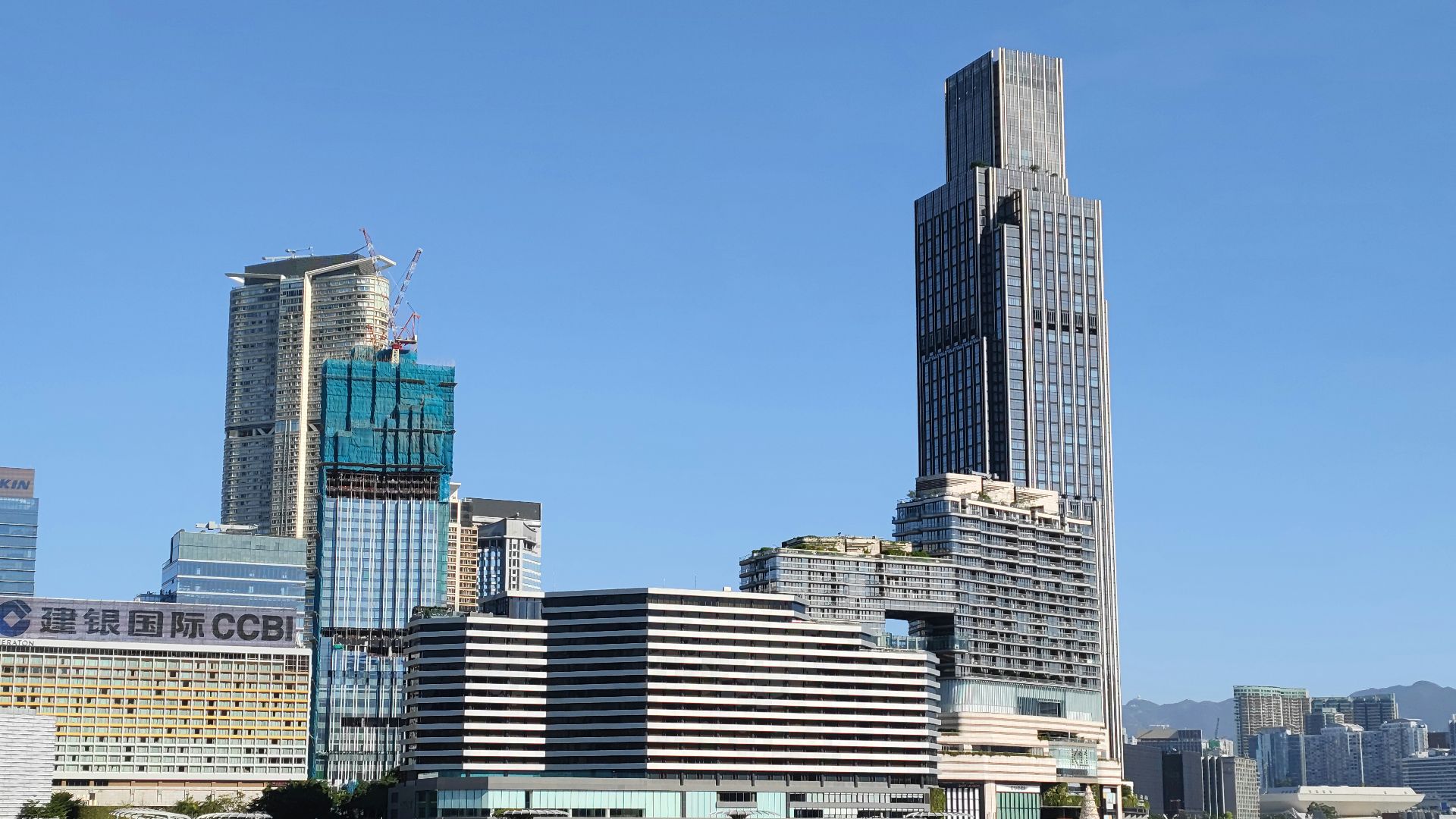 a large body of water with a city in the background