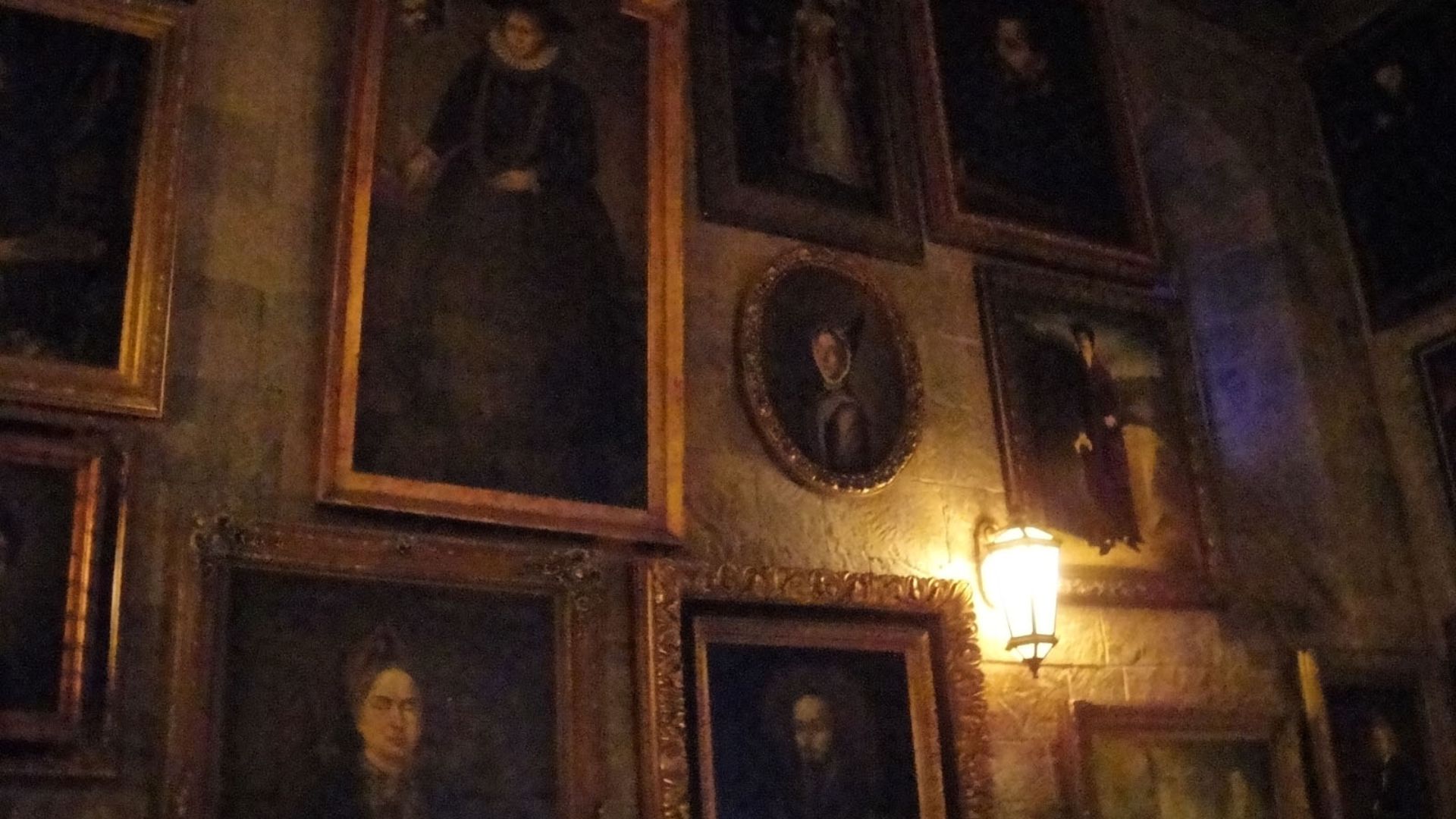 File:Wizarding World of Harry Potter - talking paintings on the walls of the queue for the Forbidden Journey (5014304028).jpg
