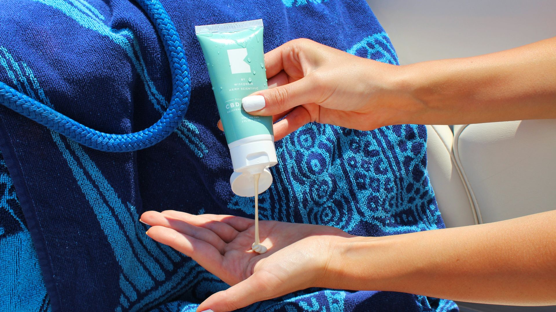 person holding white plastic tube bottle