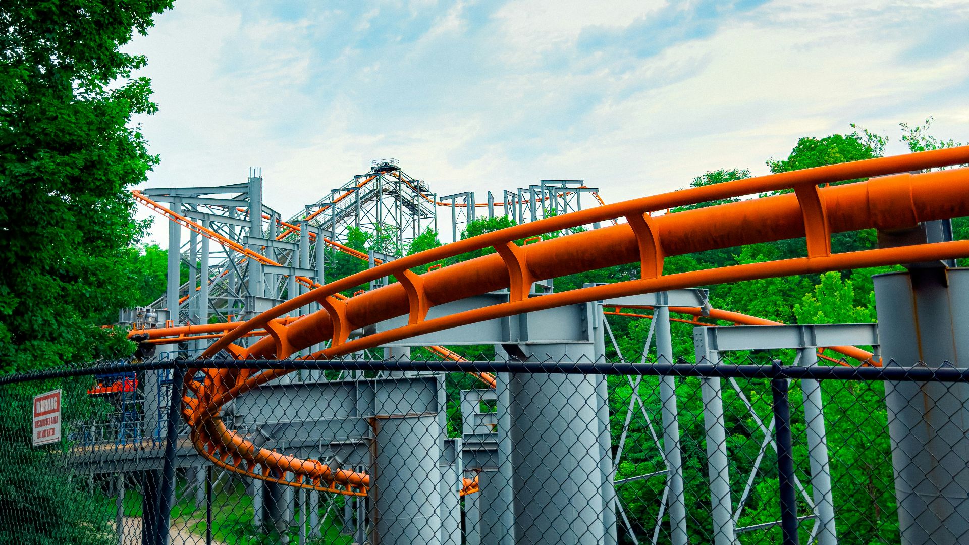 a large orange pipe going over a bridge