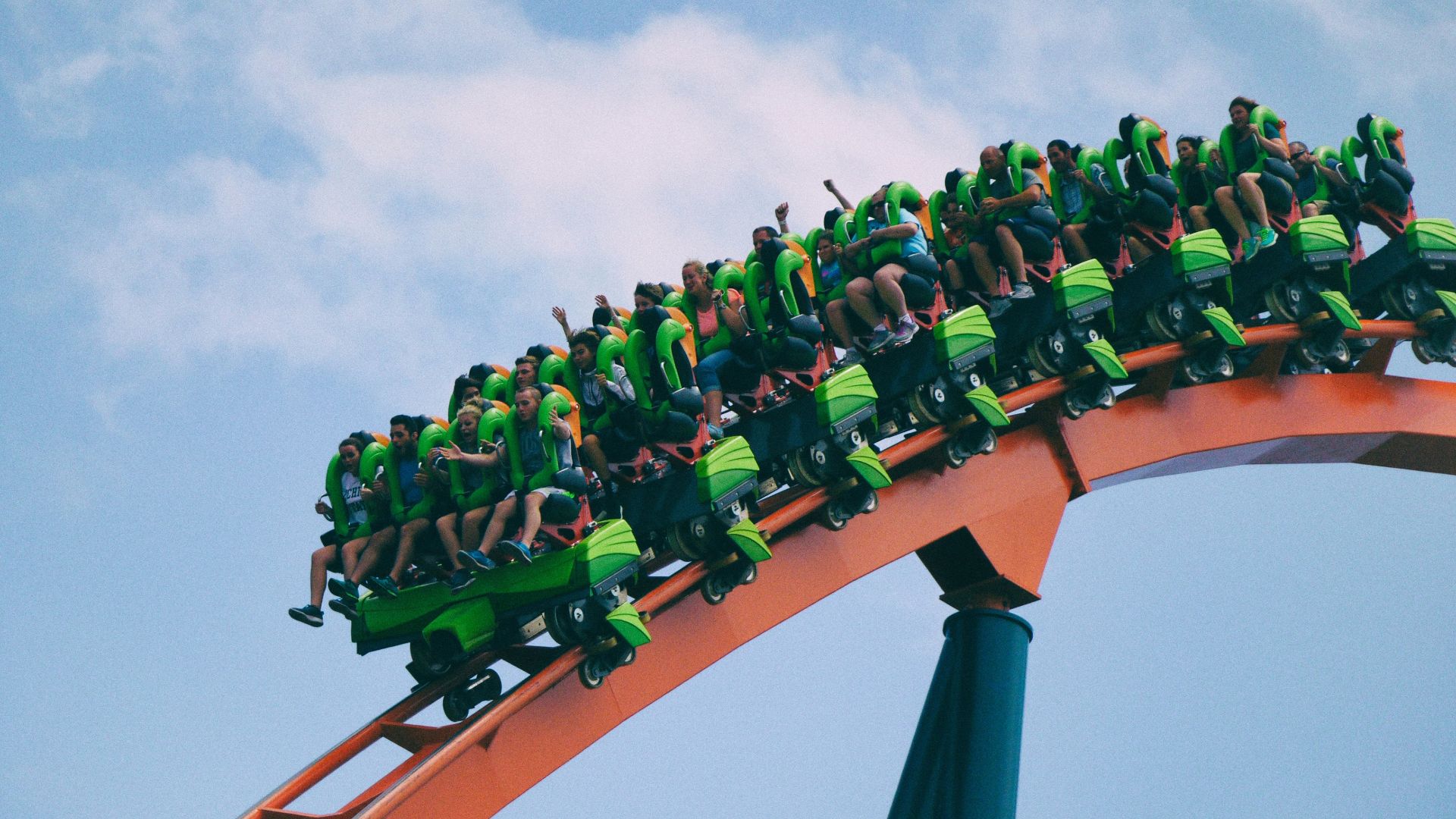 people riding on roller coaster