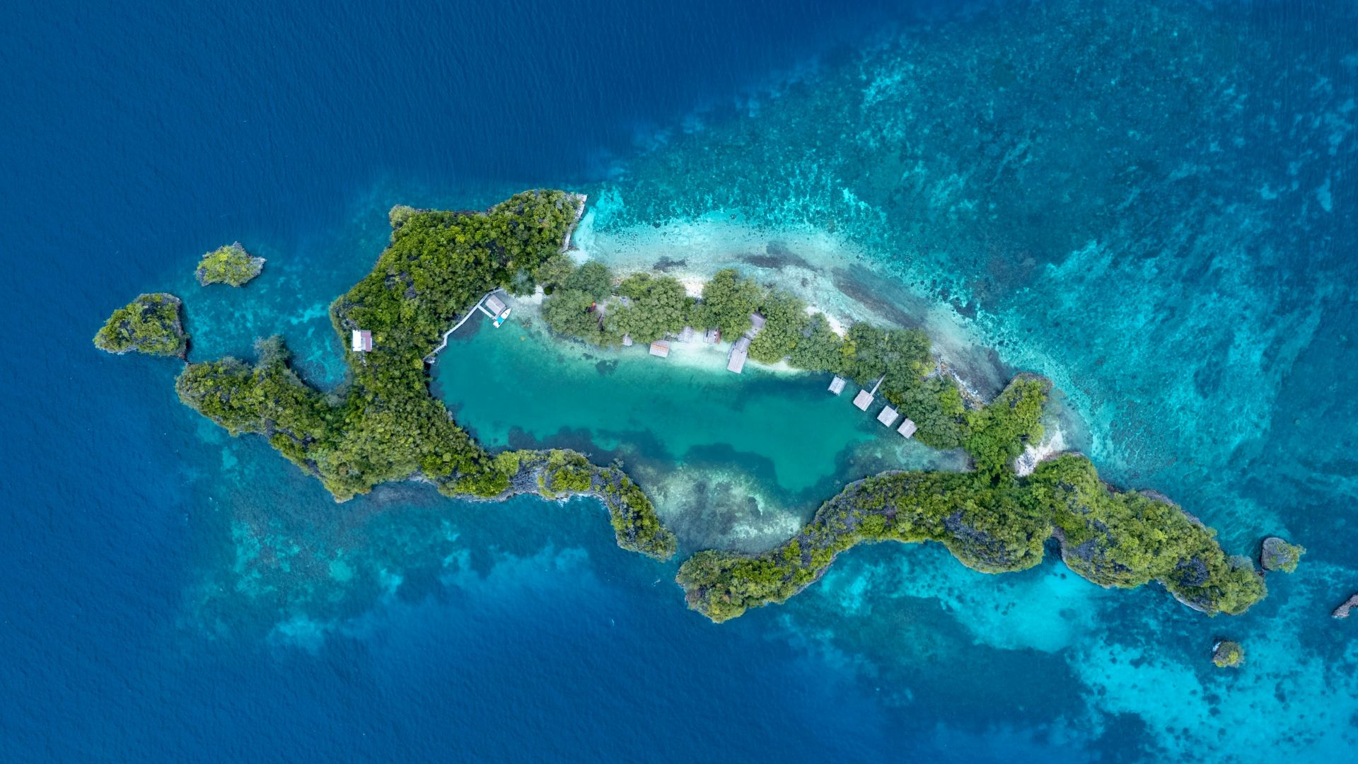 an aerial view of an island in the middle of the ocean