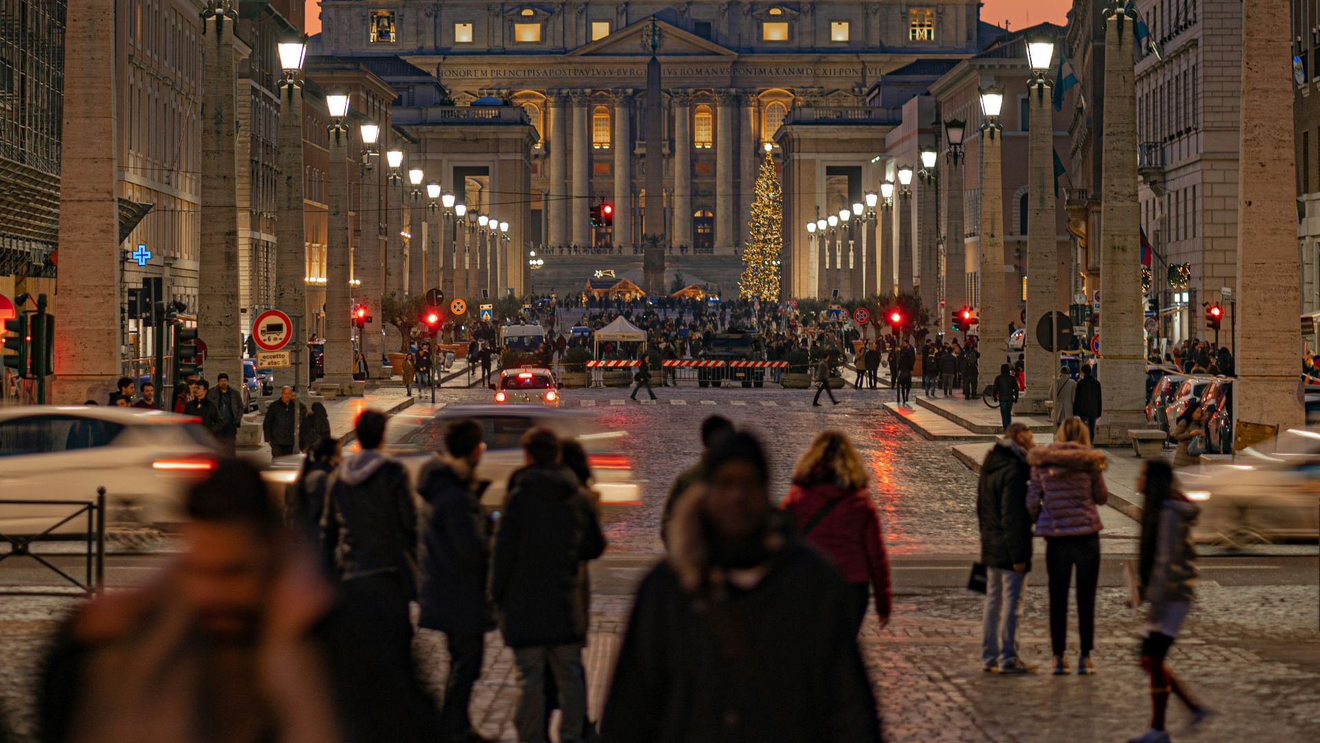 people near buildings during golden hour
