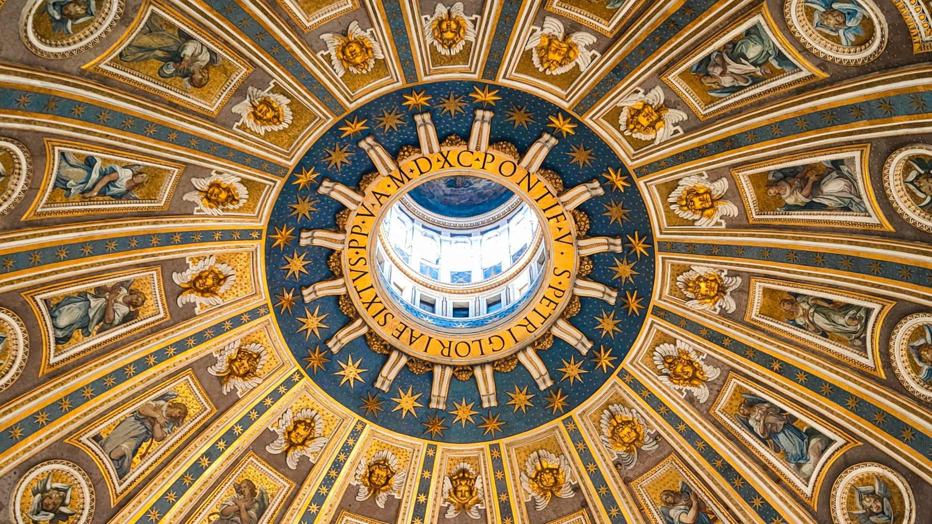 The ceiling of a building with paintings on it