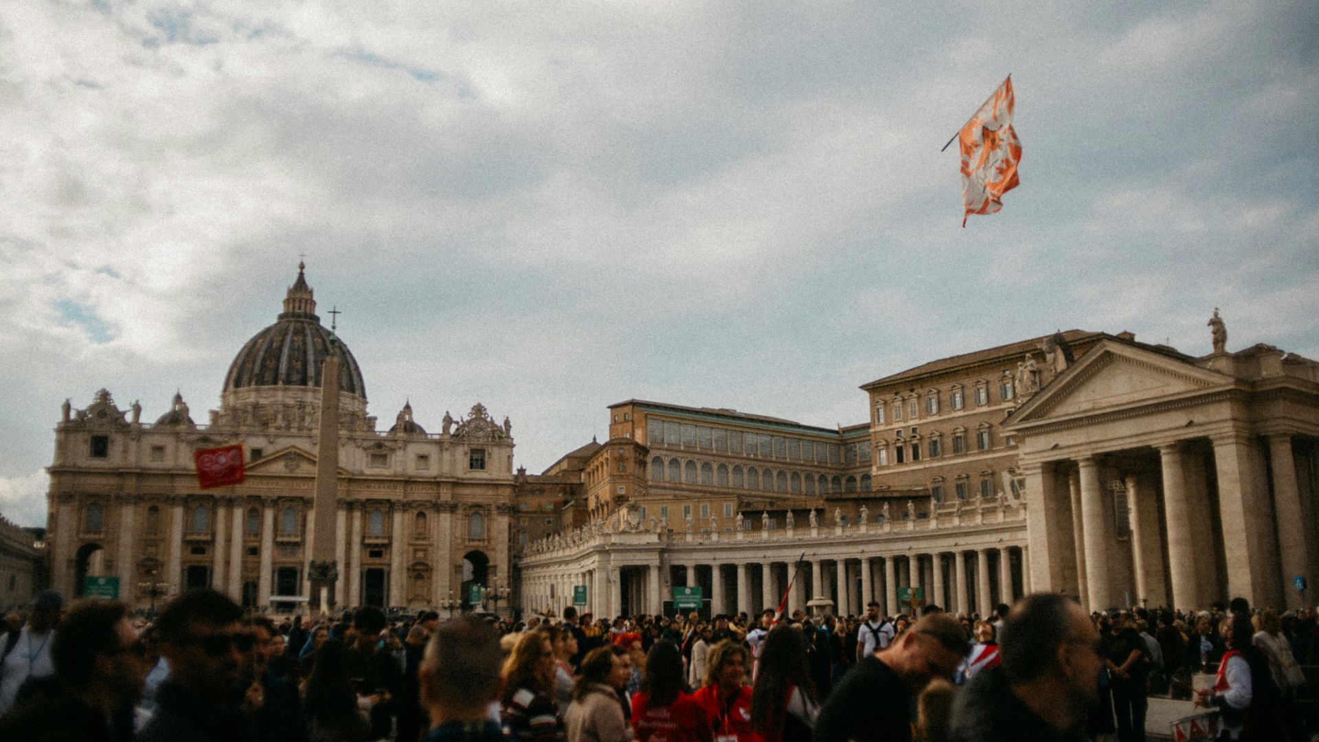 St. peter's basilica with a flag flying
