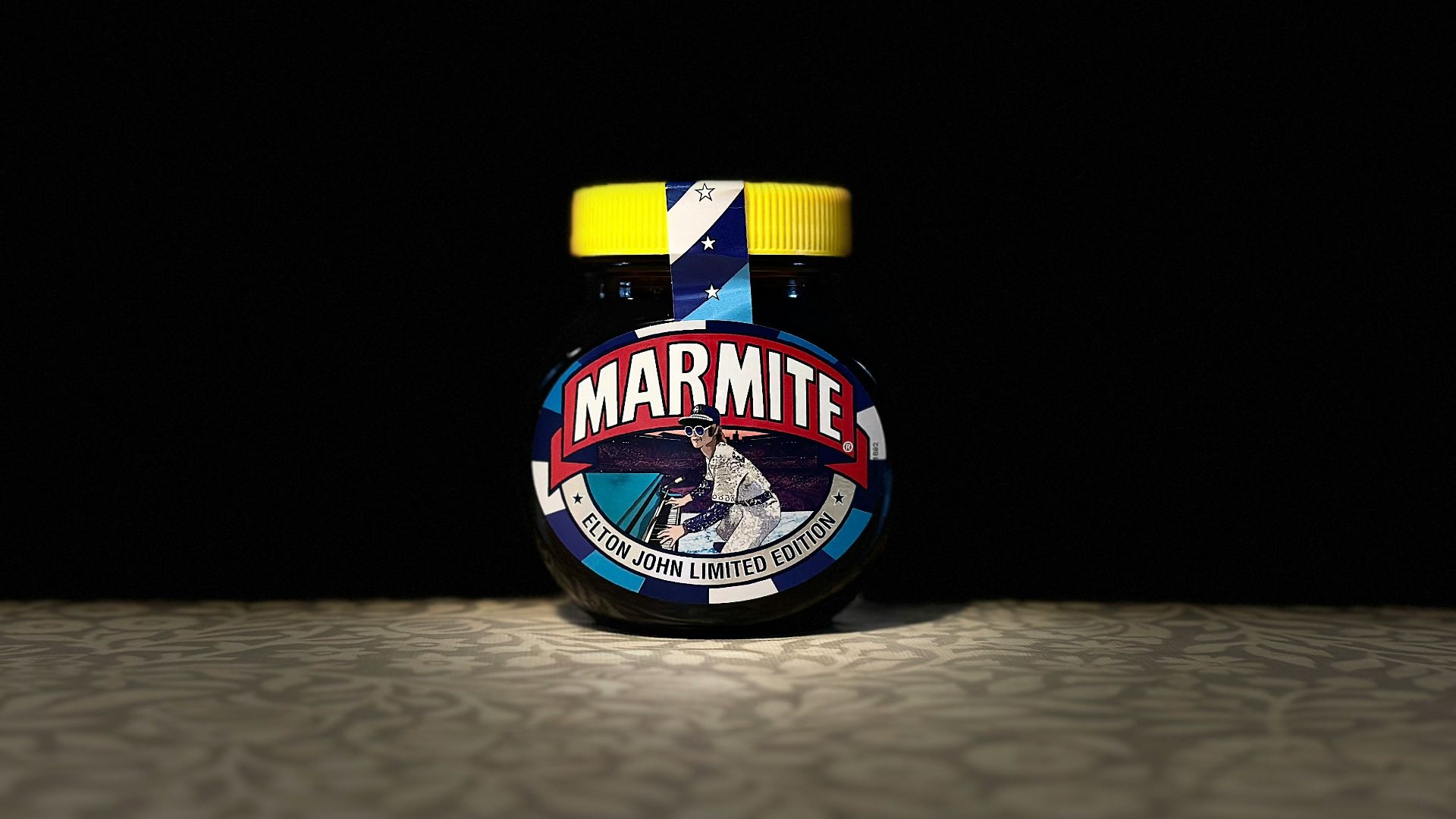 A jar of marmite sits on the floor