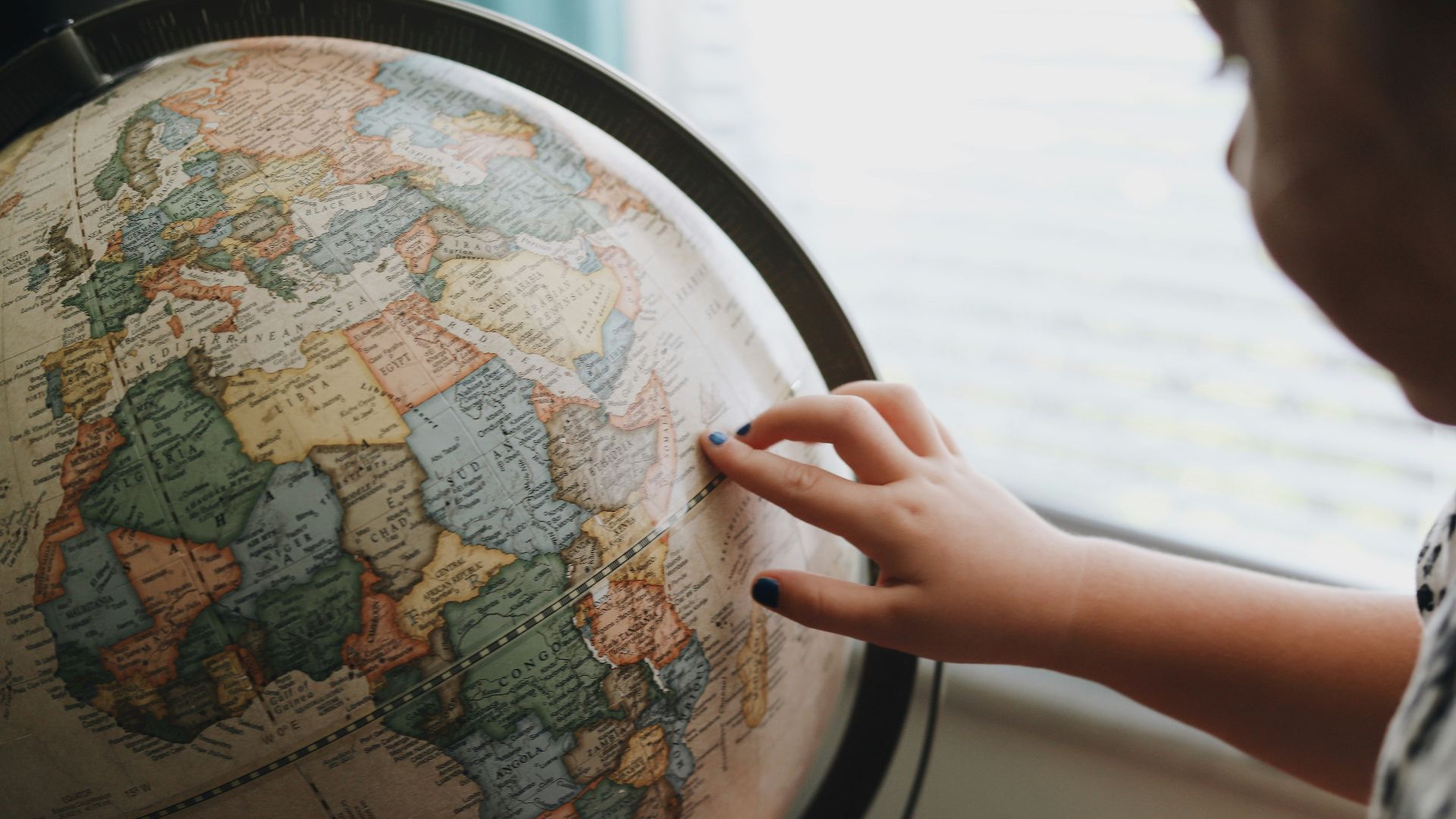 beige and blue desk globe