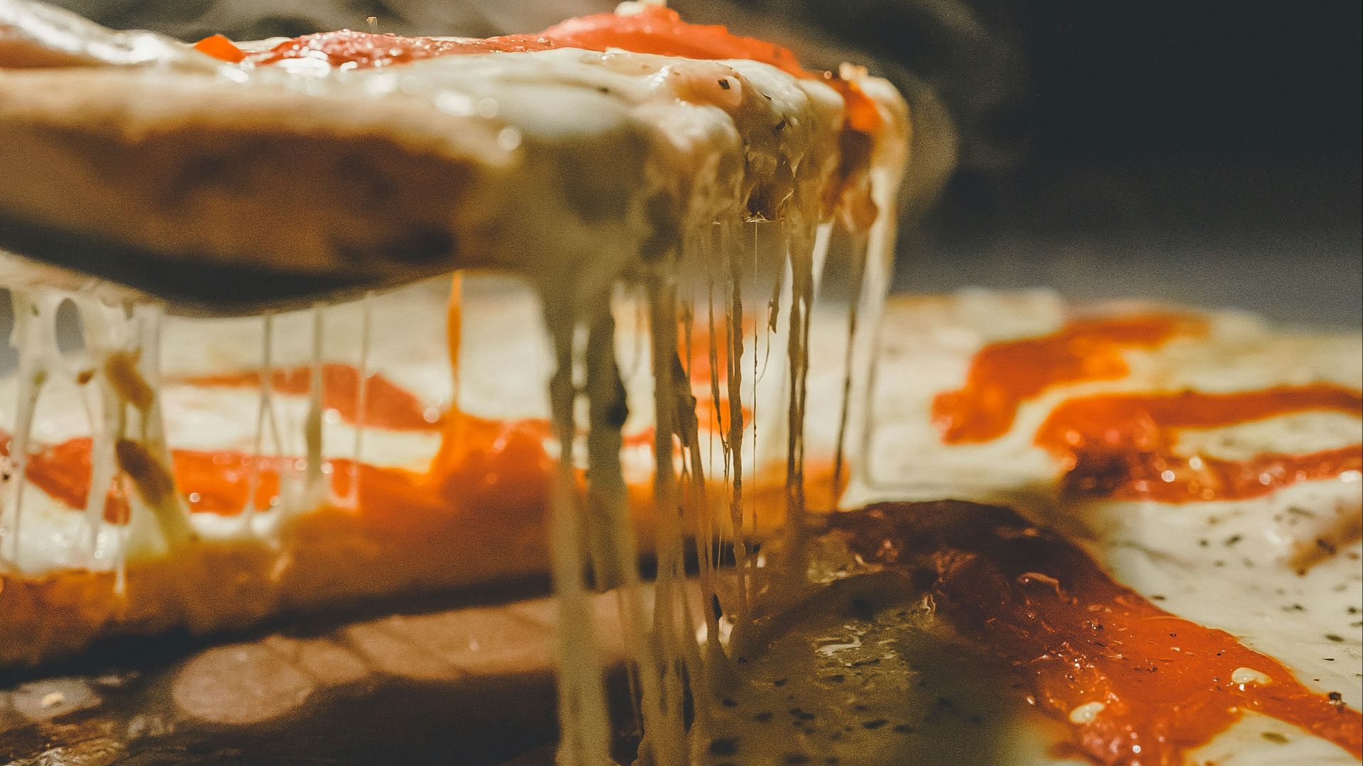 close up photo of pizza with cheese