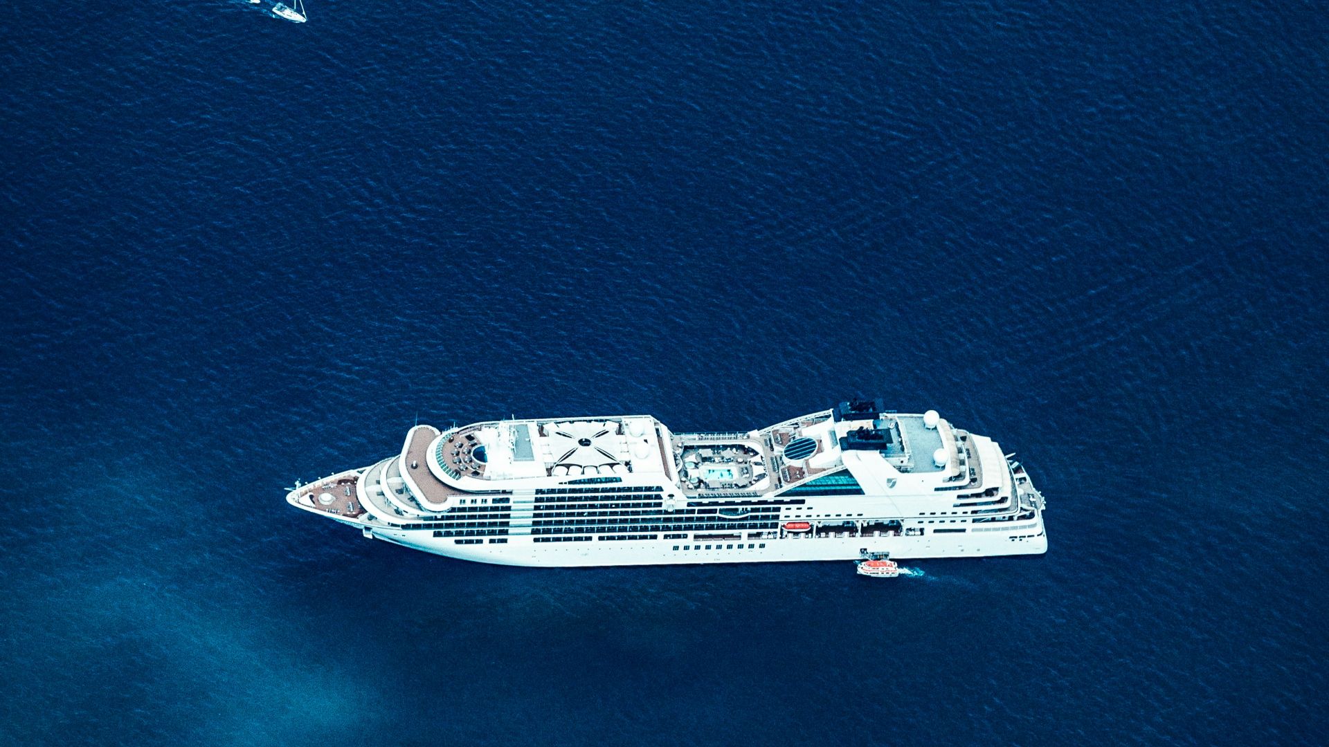 white and black ship on sea during daytime