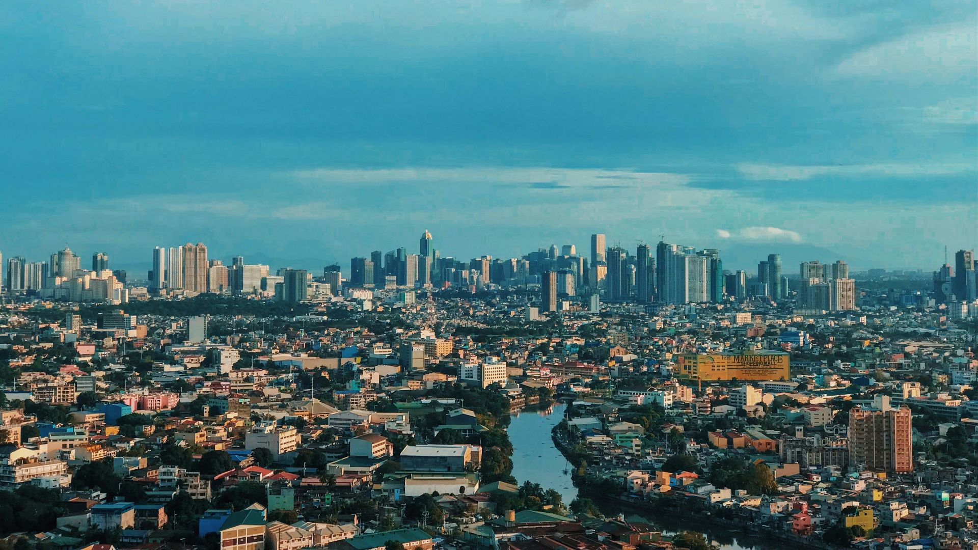 city skyline under blue sky during daytime