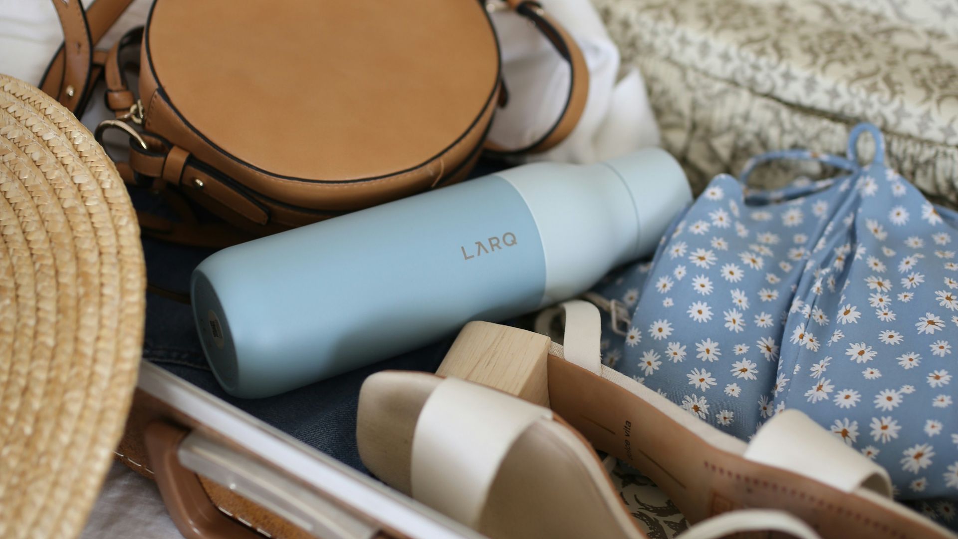 brown and gray leather suitcase