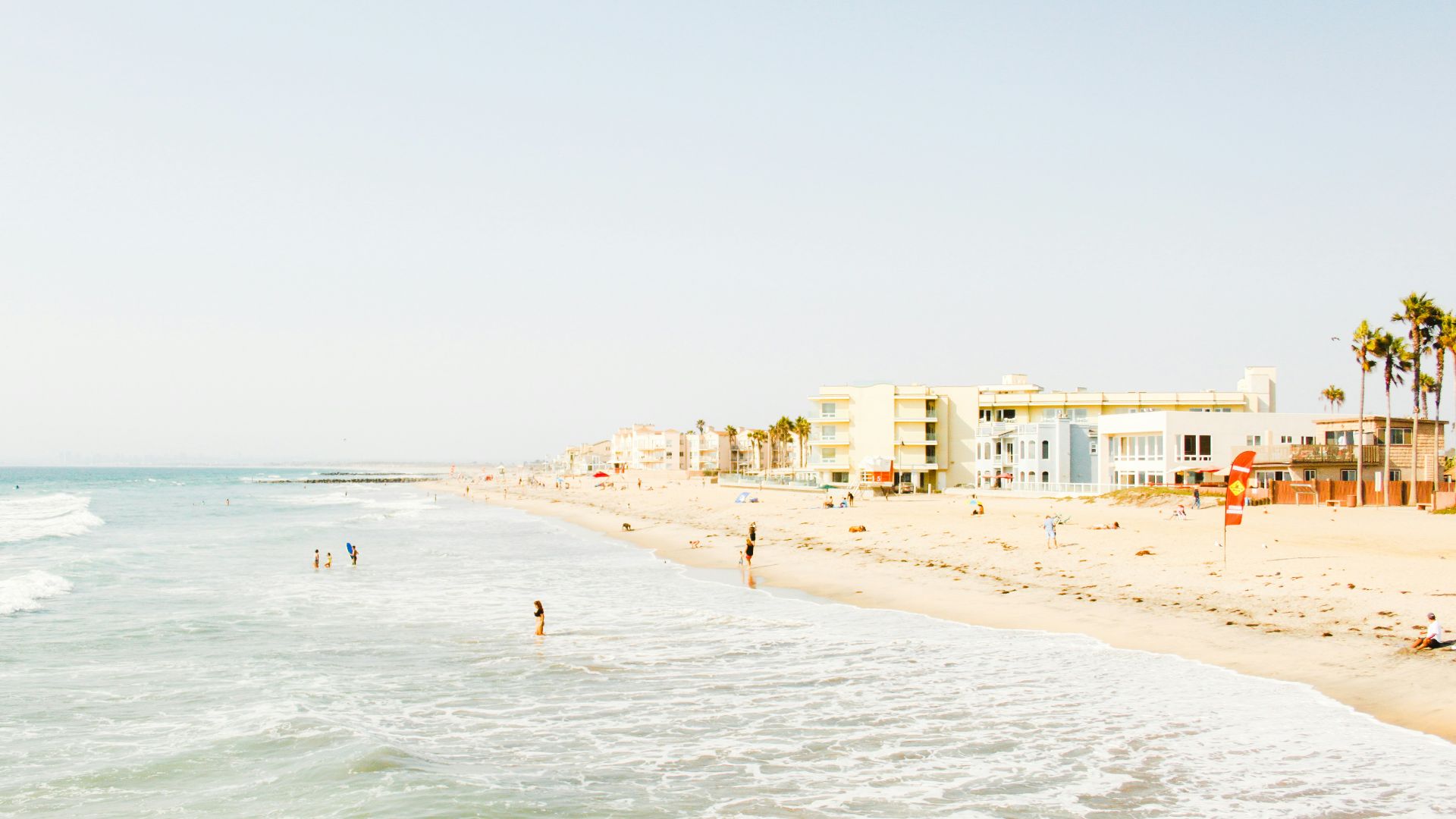 beach near building at daytime