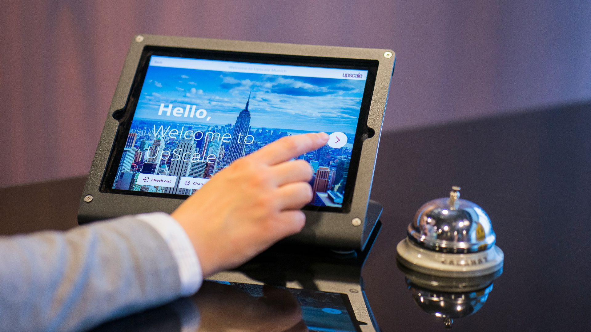 person about to touch black Android tablet computer