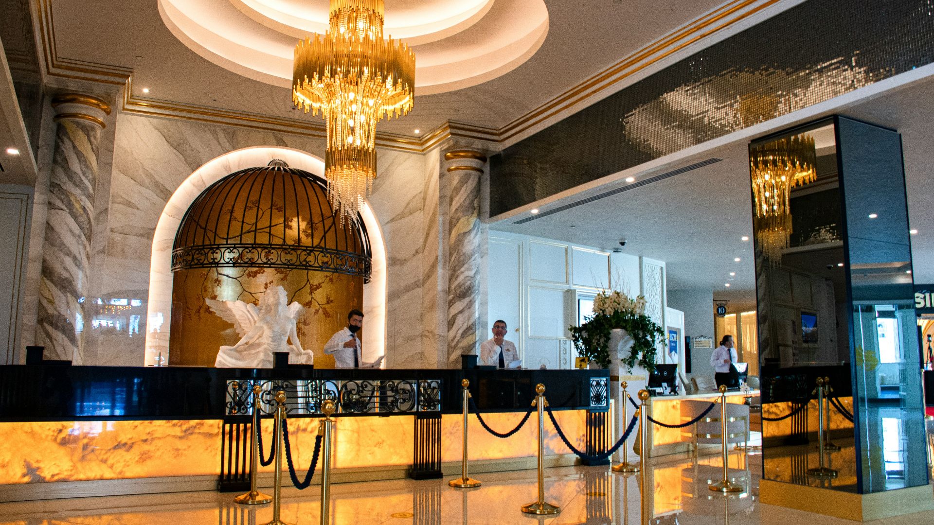 gold chandelier on white ceiling