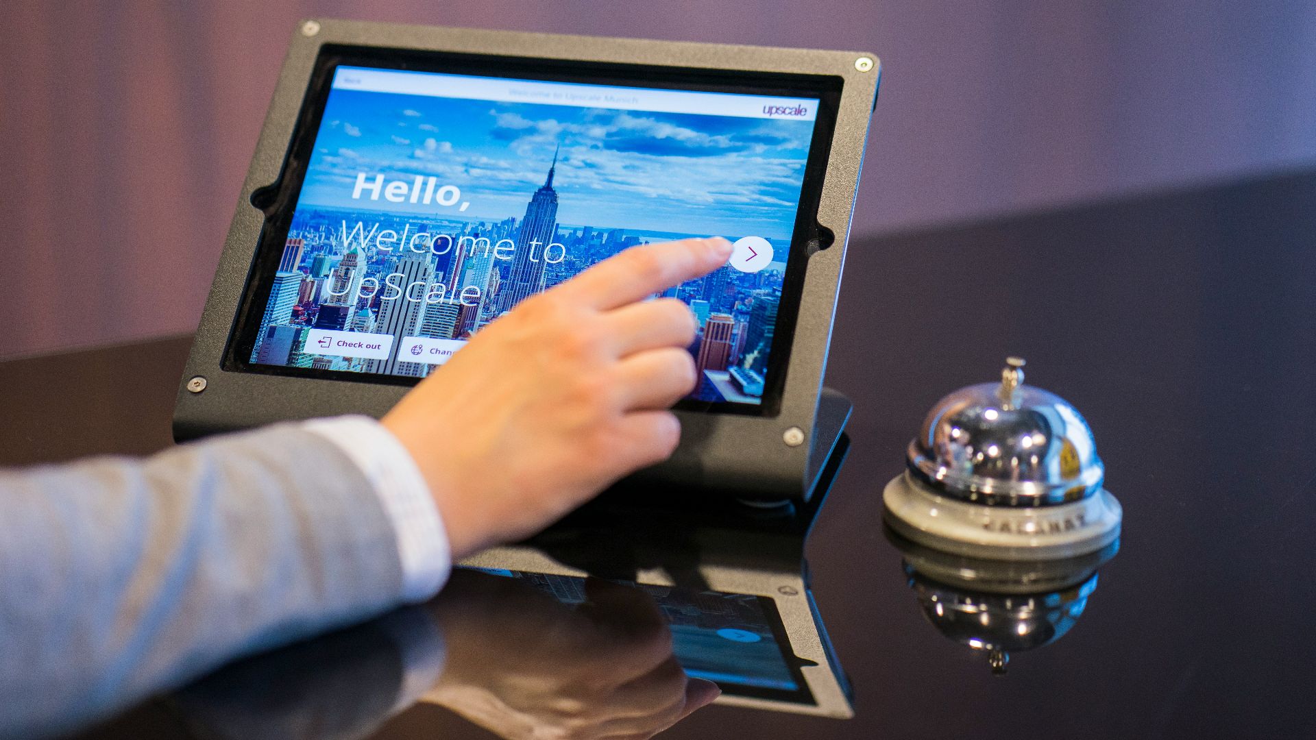 person about to touch black Android tablet computer