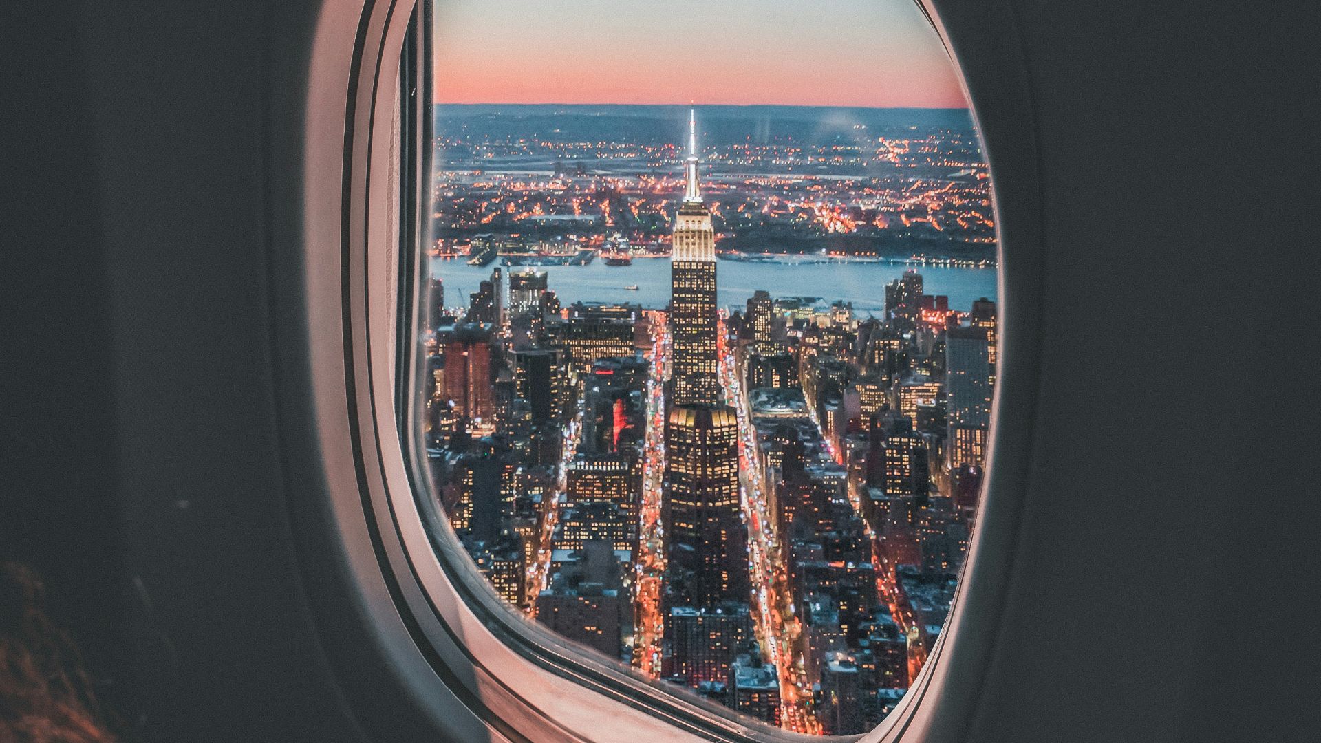 plane window photo of Empire State Building