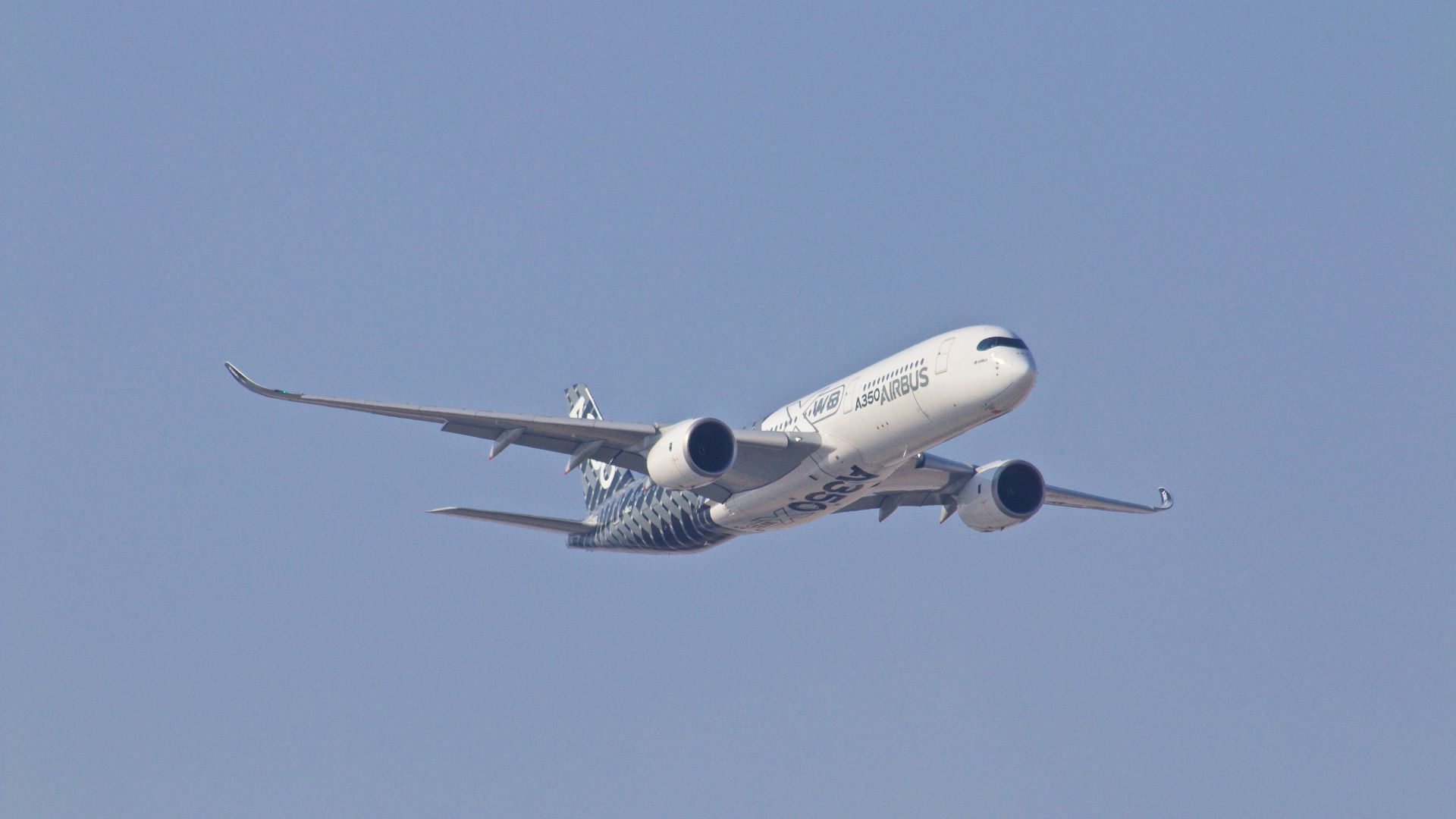white airplane taking off during daytime