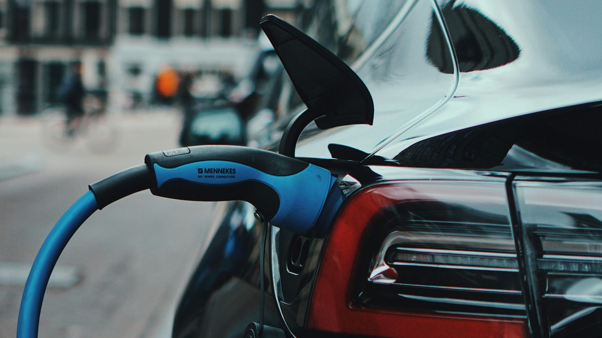 white and black car in front of white building during daytime