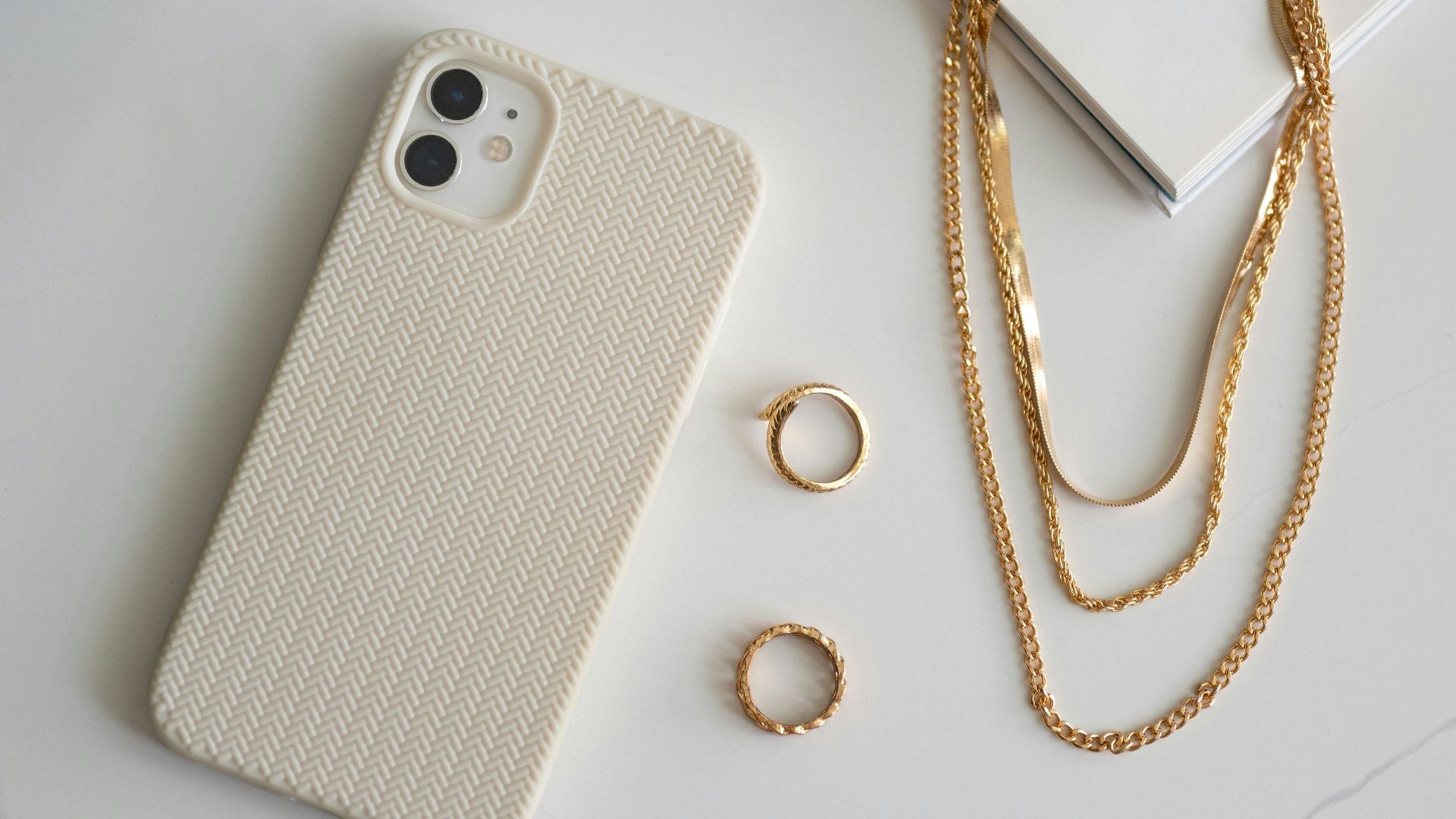 a cell phone and a ring on a table
