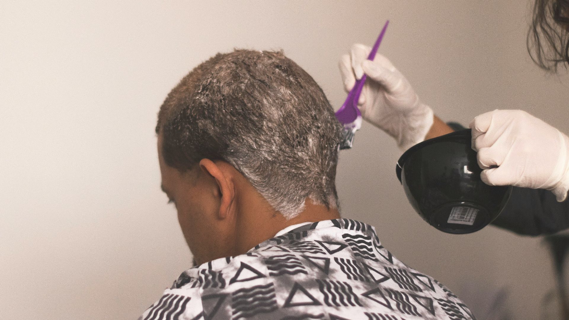 man in black and white stripe shirt wearing black headphones
