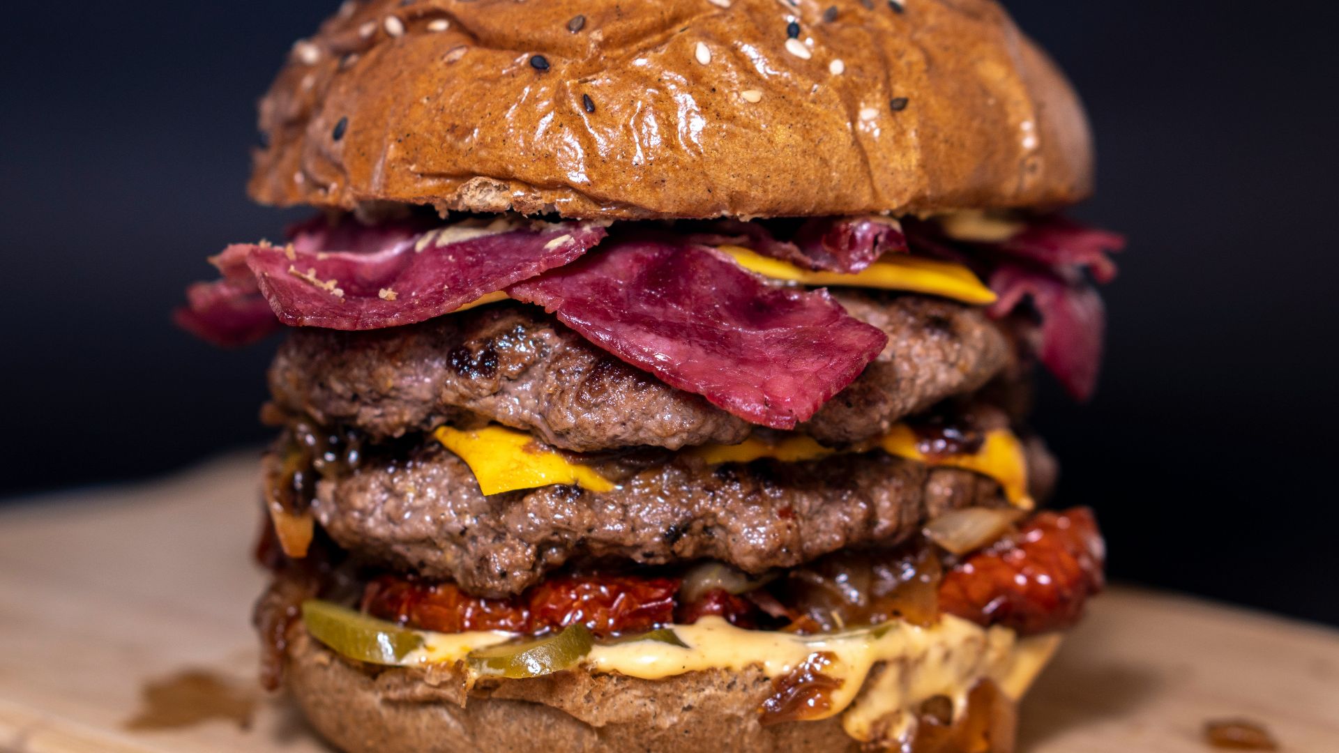 closeup photo of burger on brown surface