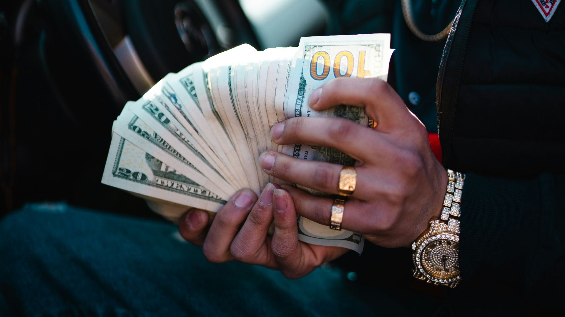 man in blue dress shirt holding white ceramic mug