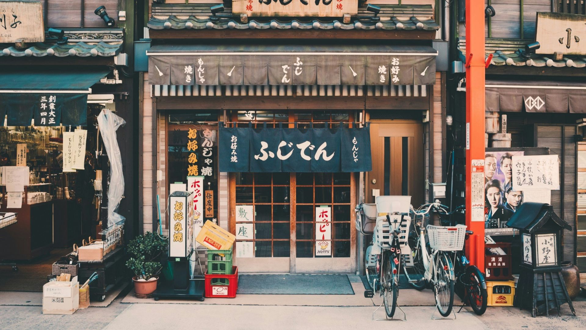 three bicycles parked in front of building