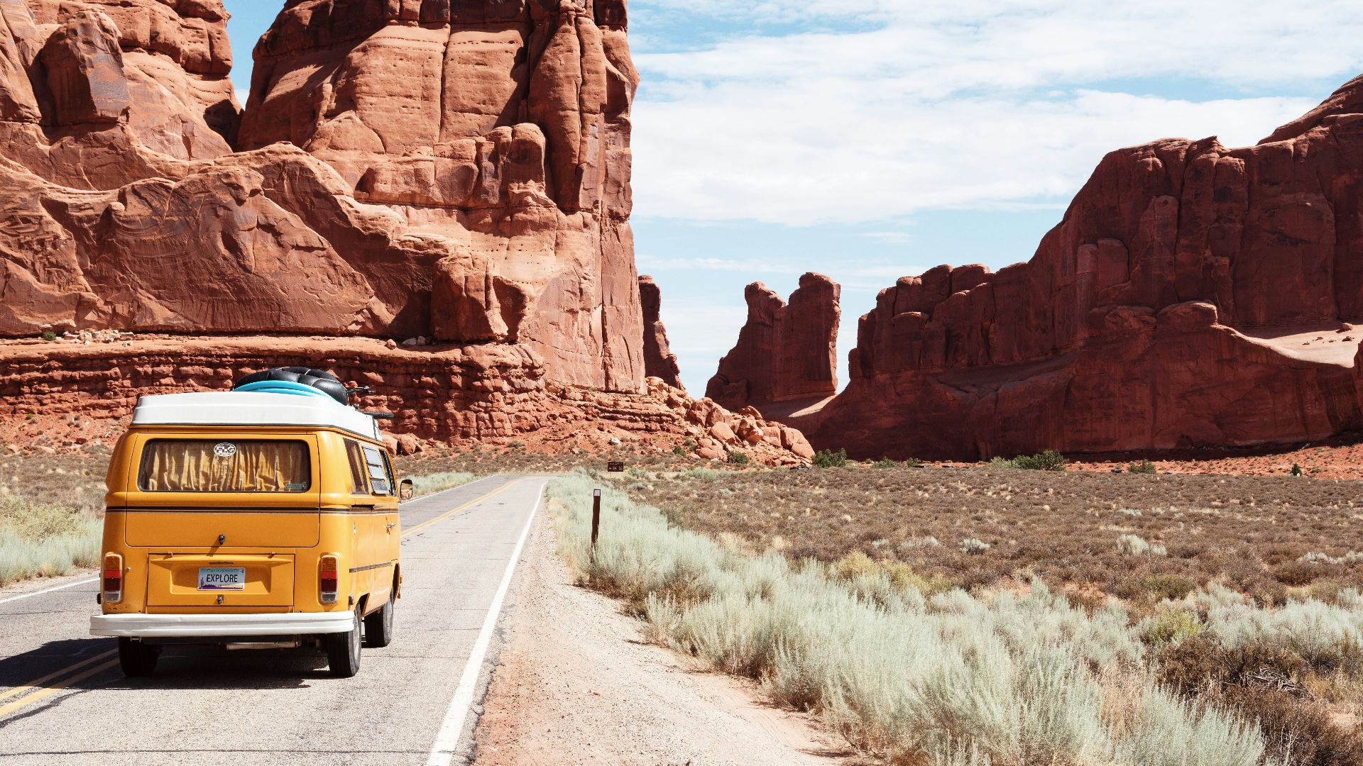 yellow Volkswagen van on road
