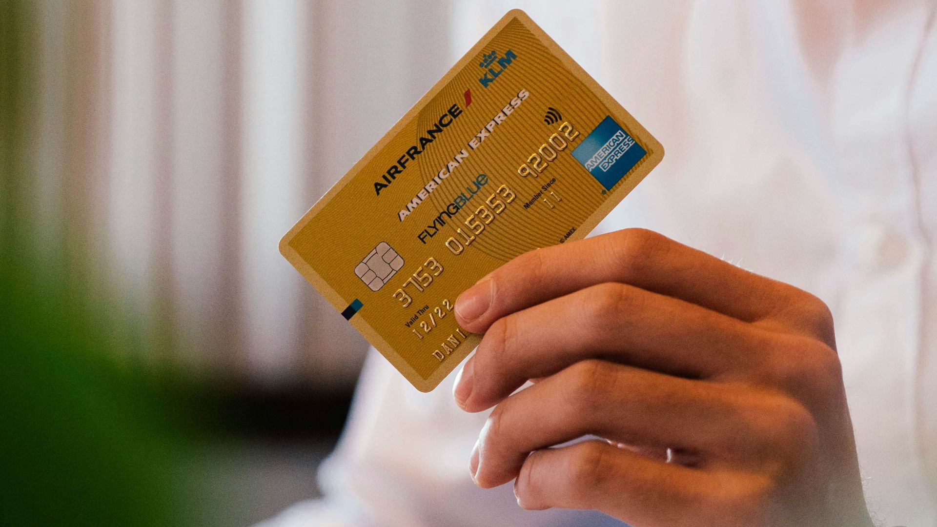 person holding credit card