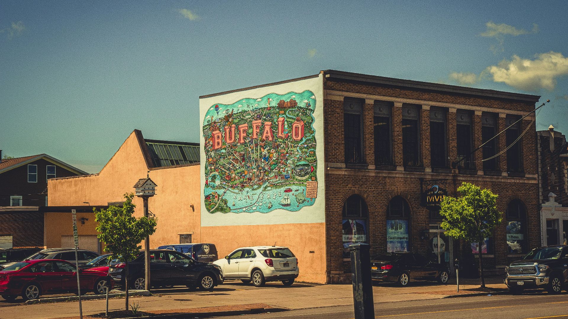 cars parked in front of building